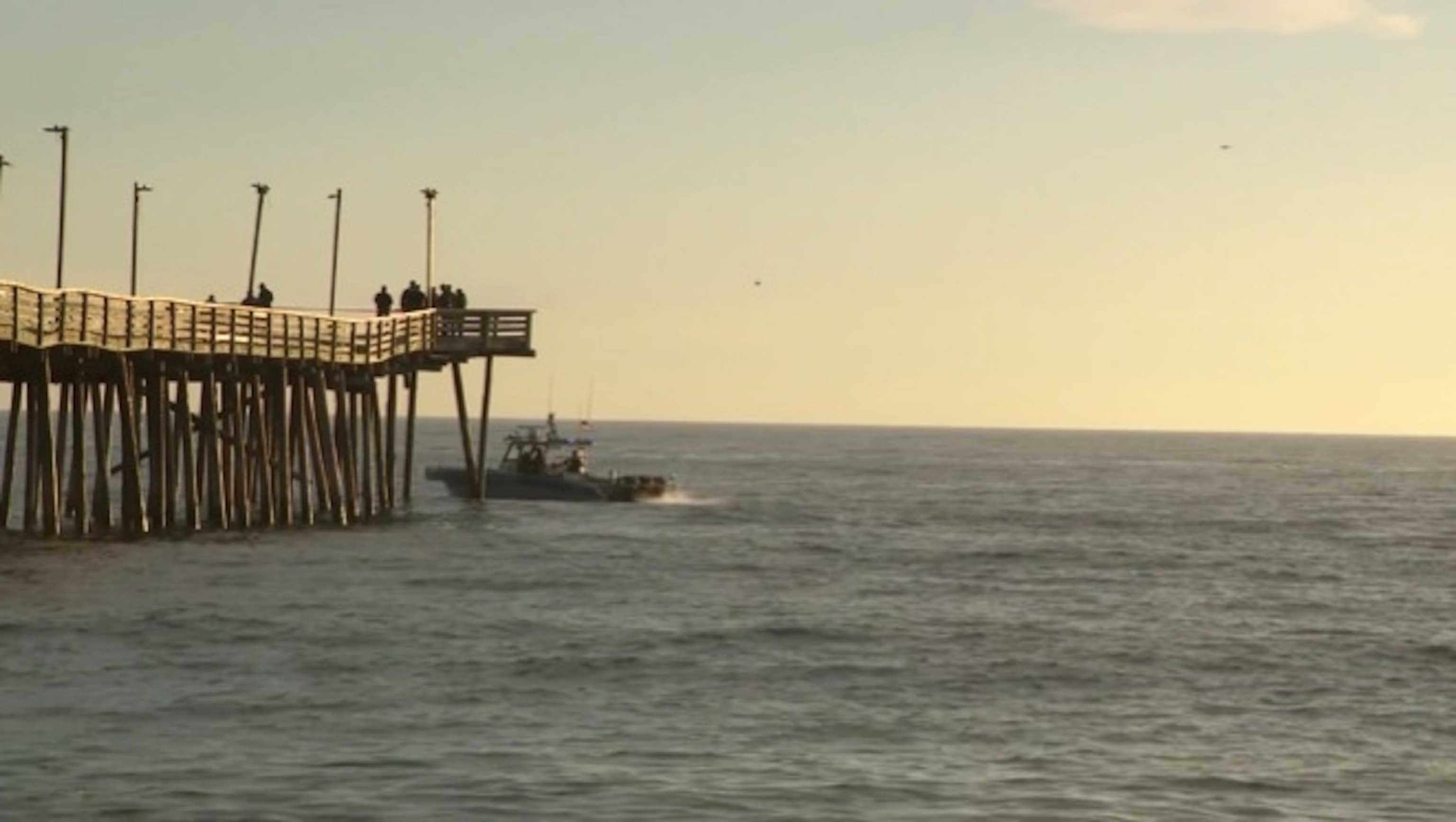 PHOTO: Law enforcement officials work at the scene where a car drove off the fishing pier in Virginia Beach, Virginia, on Jan. 27, 2024.