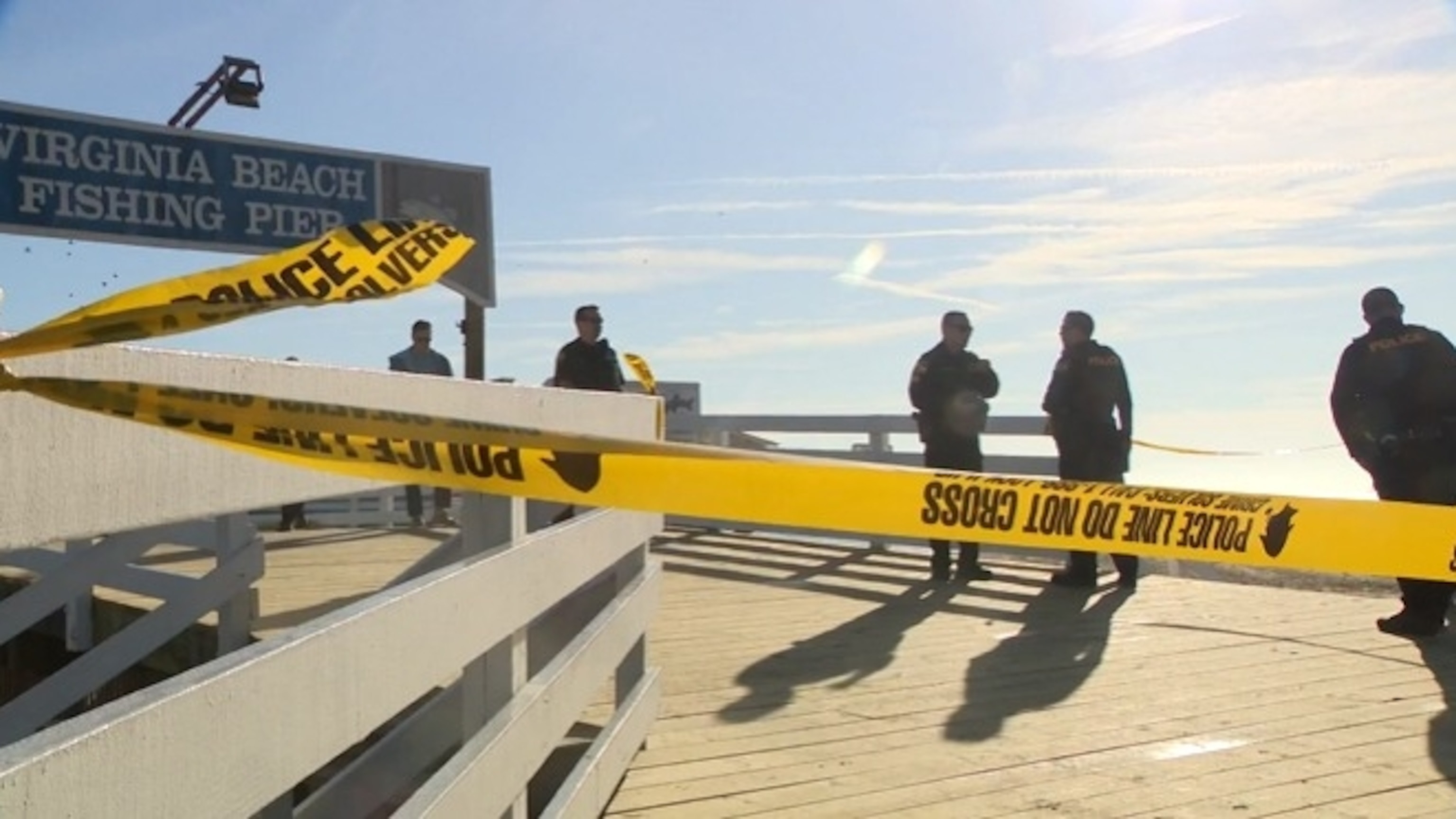 PHOTO: Law enforcement officials work at the scene where a car drove off the fishing pier in Virginia Beach, Virginia, on Jan. 27, 2024.