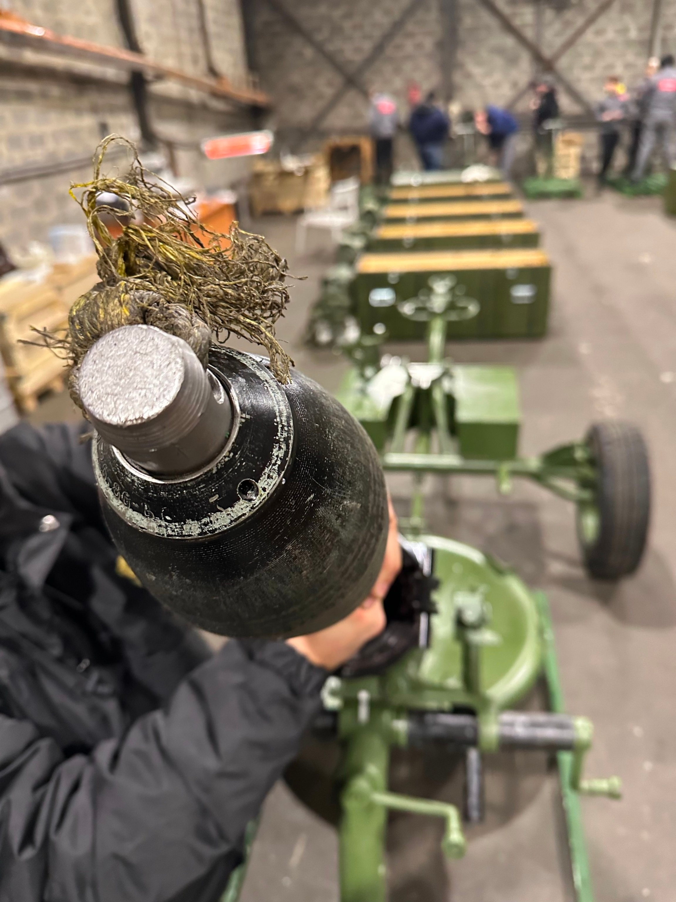 PHOTO: A dummy mortar round is loaded into a mortar launcher inside a secrete Ukraine production facility.