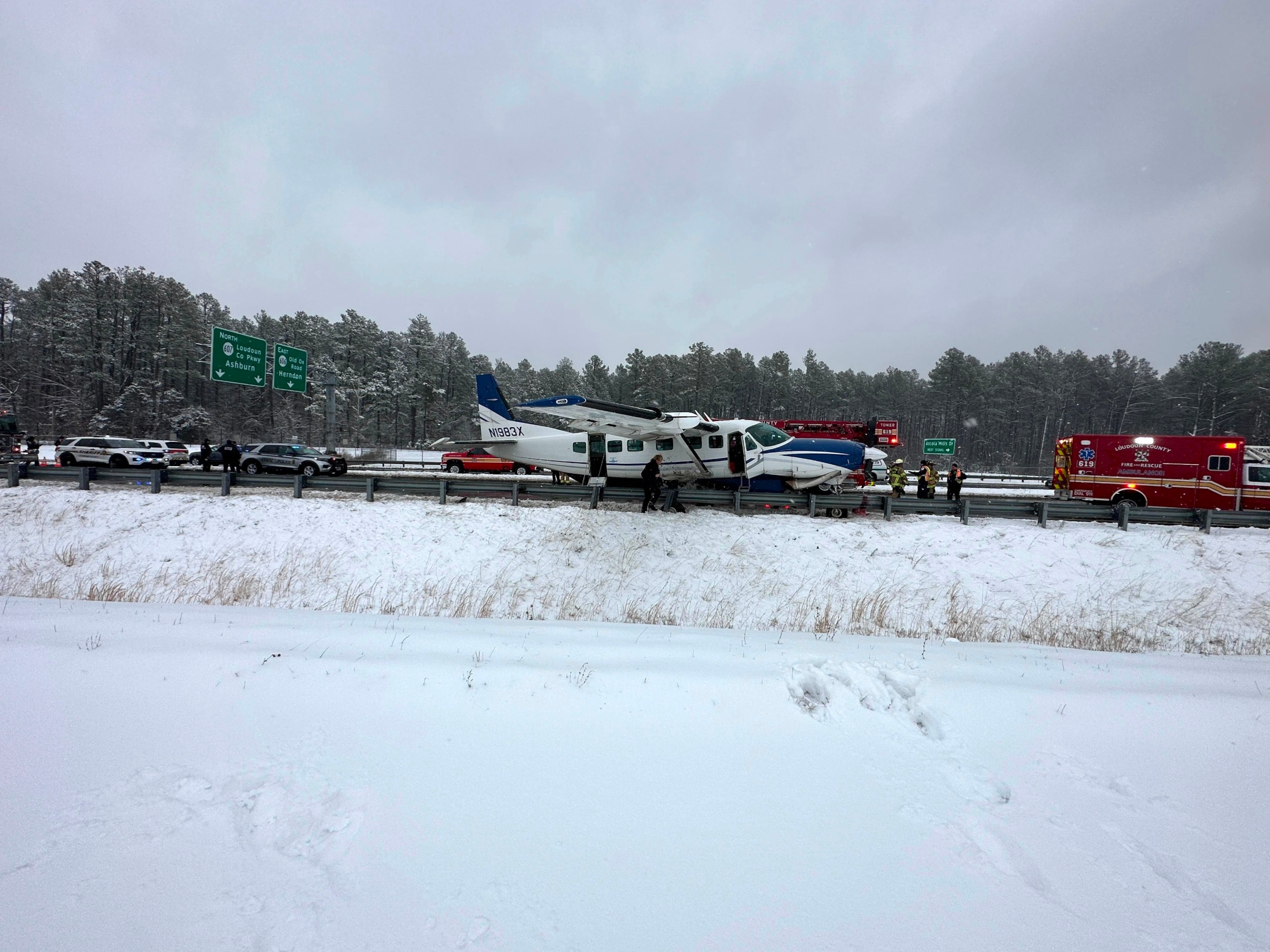 PHOTO: A small plane in the roadway and blocking all lanes of Loudoun County Pkwy at Arcola Mills Dr. in Dulles, Va., Jan. 19, 2024.