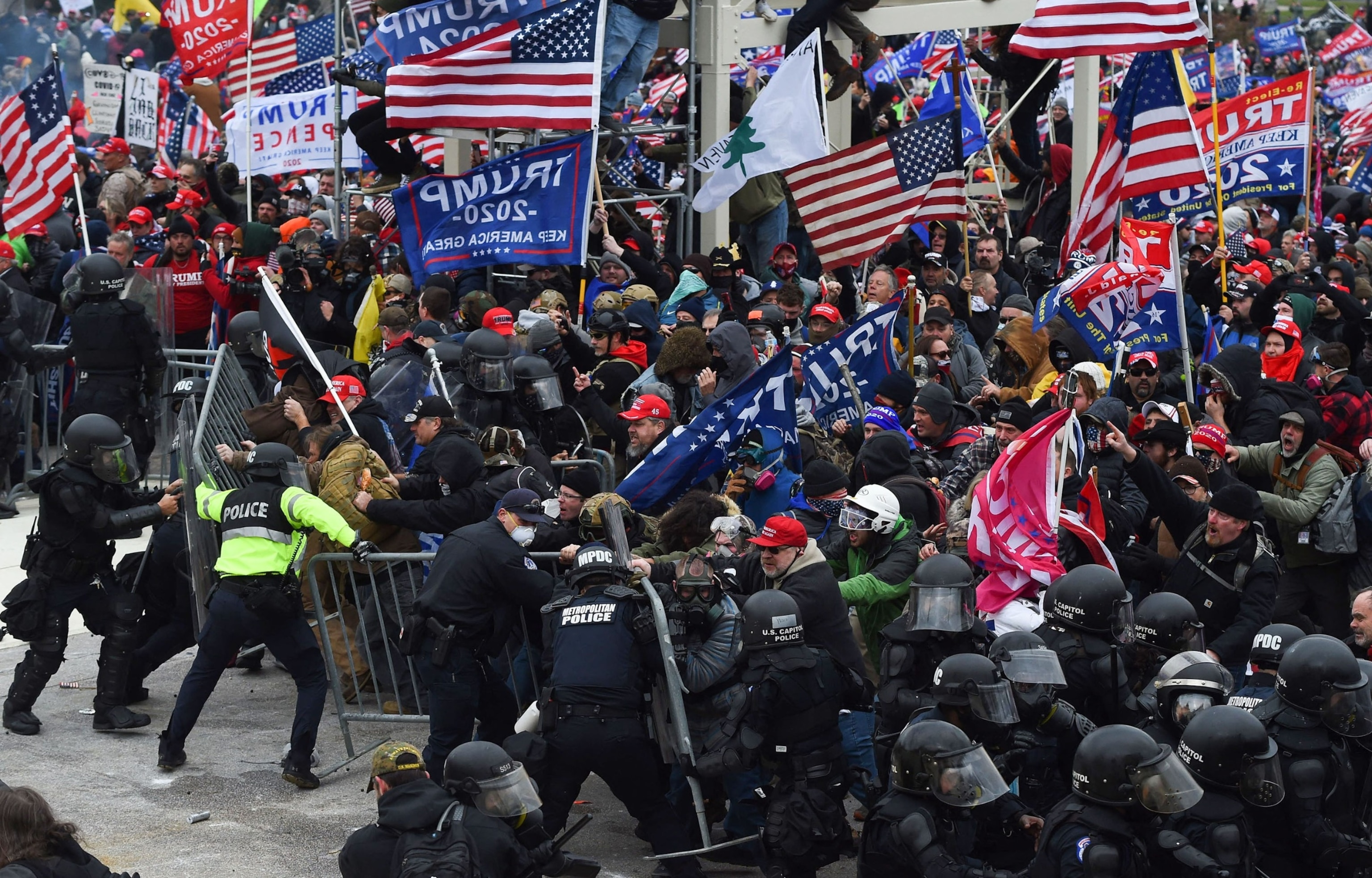 PHOTO: Trump supporters clash with police and security forces as they push barricades to storm the US Capitol in Washington D.C, Jan. 6, 2021. 