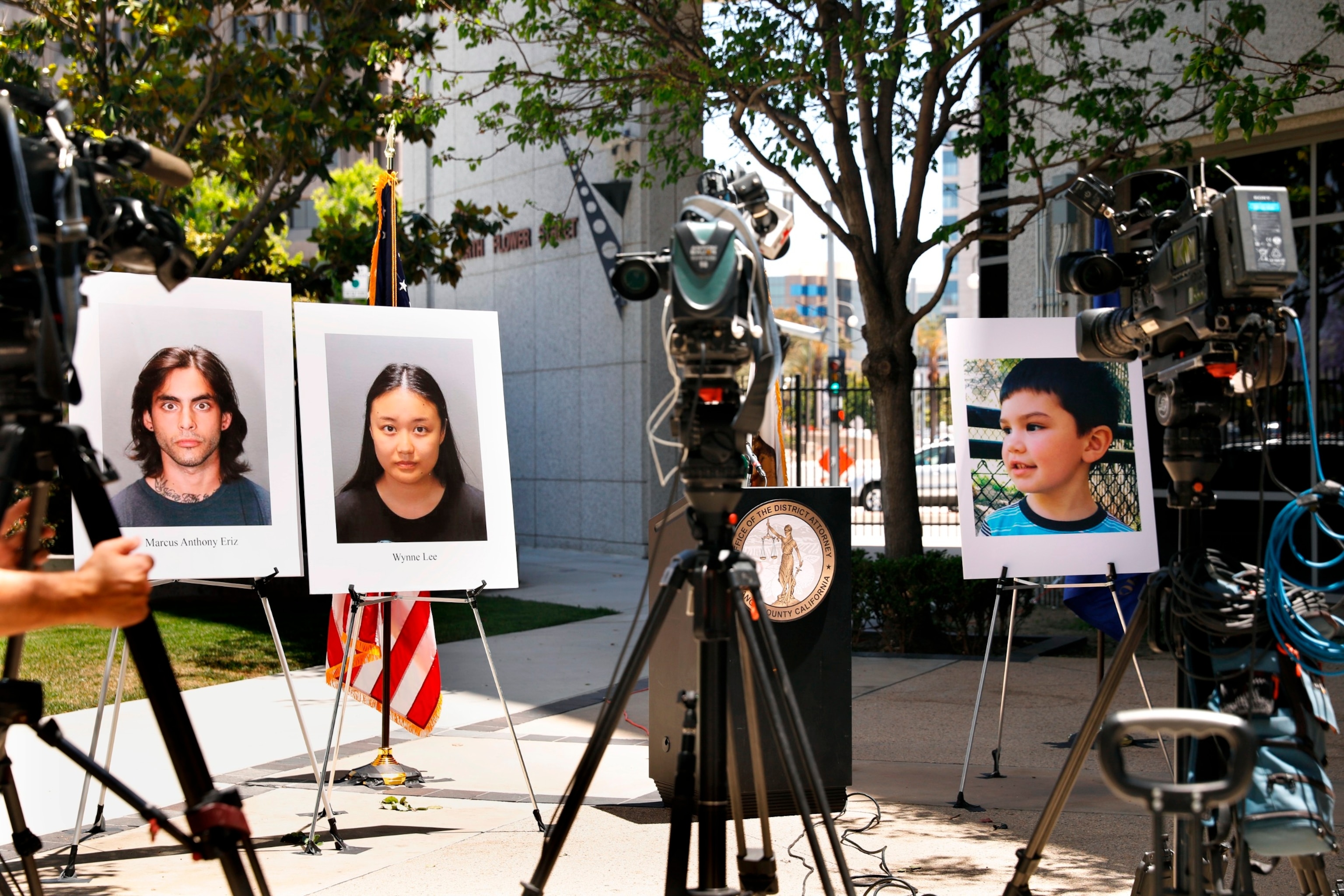 PHOTO: Orange County District Attorney Todd Spitzer holds a press conference to discuss the criminal charges being filed against two suspects Marcus Anthony Eriz and Wynne Lee, left, in the shooting death of 6-year-old Aiden Leos. 