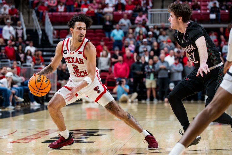 LUBBOCK, TEXAS - DECEMBER 06: Pop Isaacs #2 of the Texas Tech Red Raiders handles the ball during the first half of the game against the Omaha Mavericks at United Supermarkets Arena on December 06, 2023 in Lubbock, Texas. (Photo by John E. Moore III/Getty Images)