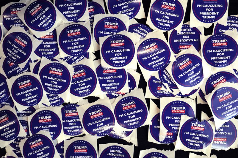 INDIANOLA, IOWA - JANUARY 14: Campaign stickers sit on a table during a rally with former President Donald Trump at Simpson College on January 14, 2024 in Indianola, Iowa. The event was Trump's final scheduled event before tomorrow's Iowa Caucus. (Photo by Scott Olson/Getty Images)