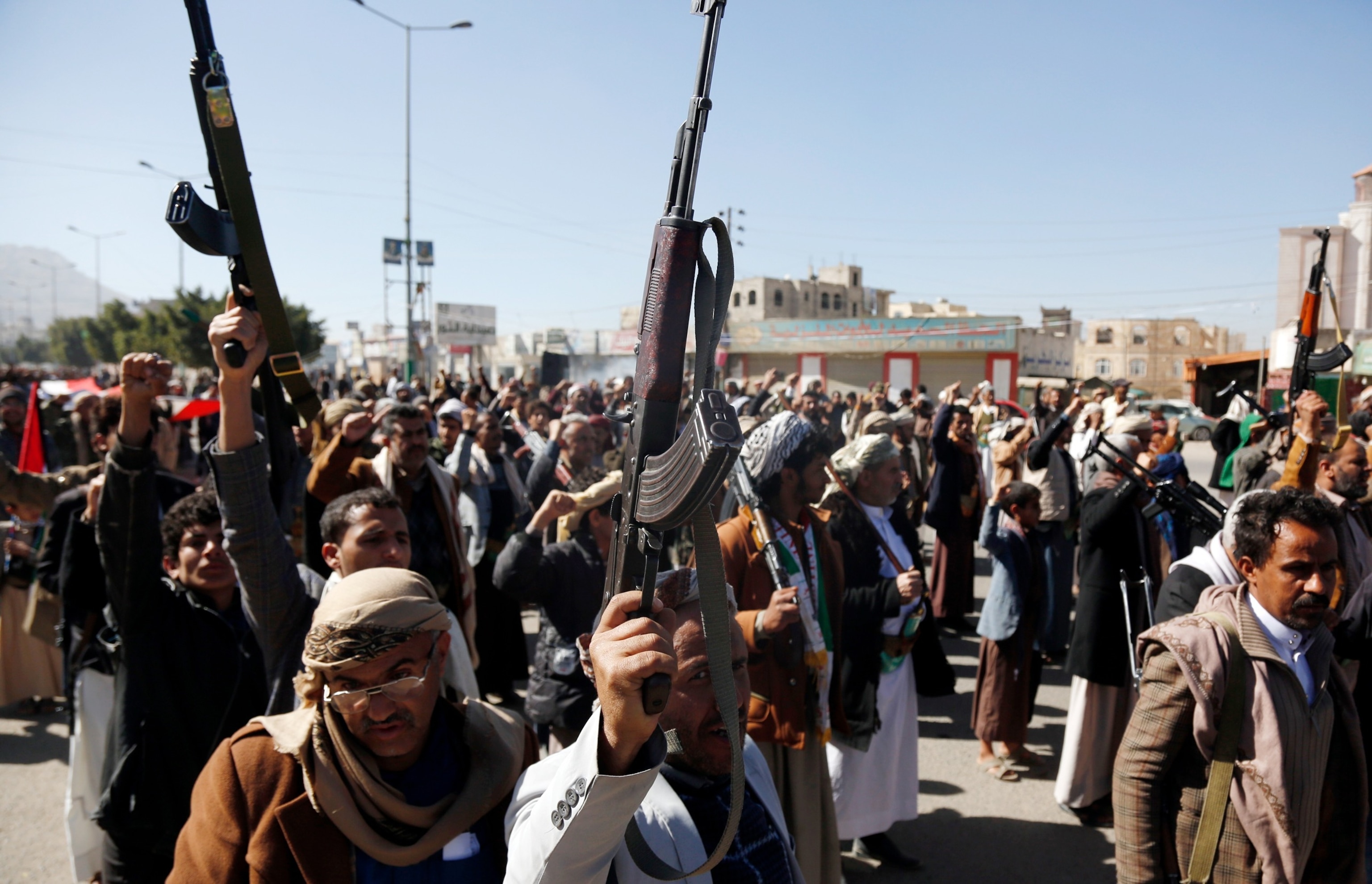 PHOTO: Yemeni protestors loyal to the Houthi movement lift their rifles as they participate in a protest held against Israel's ongoing war on Gaza Blinken's warning of a military response to rebel attacks in the Red Sea on Jan. 11, 2024 in Sanaa, Yemen.