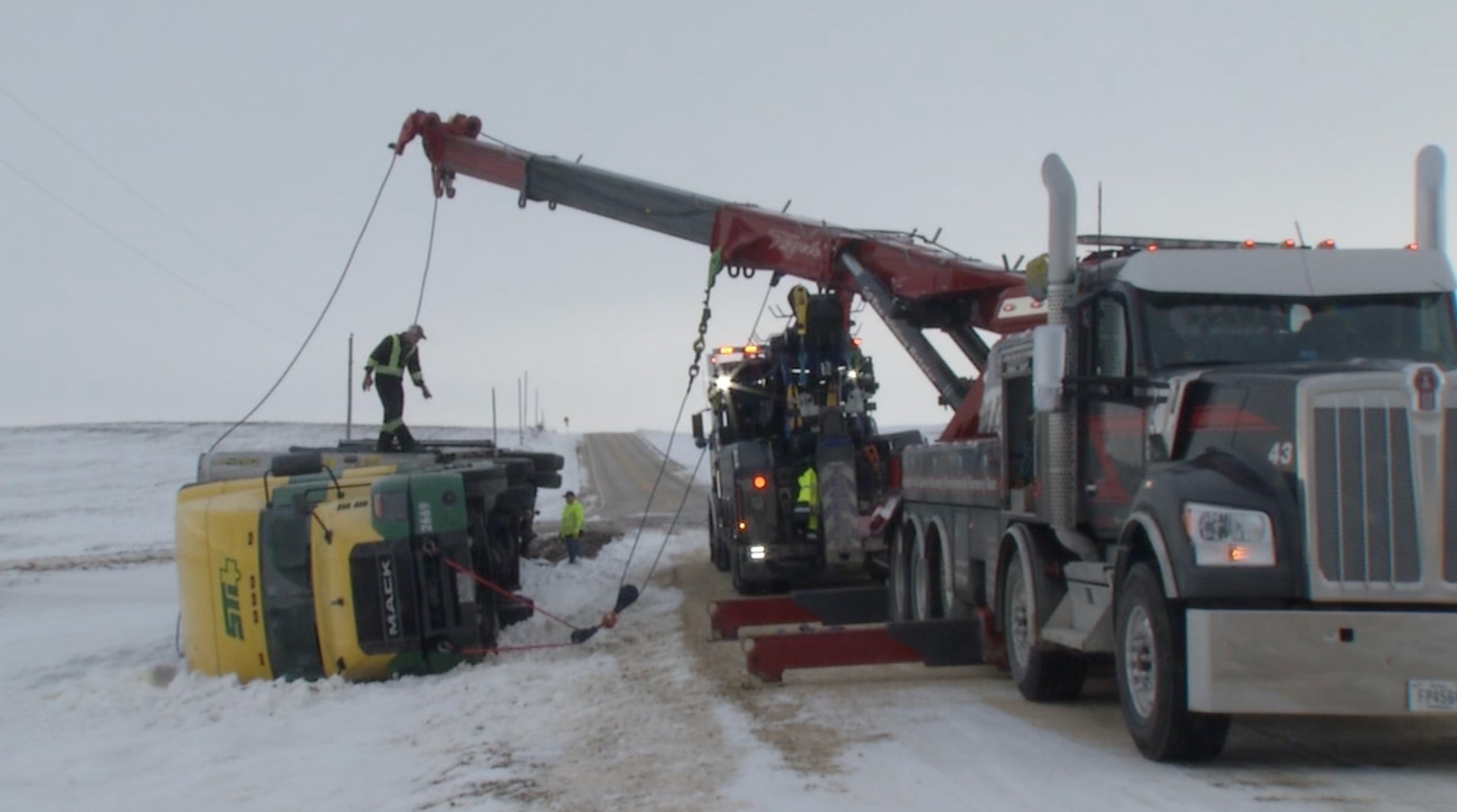 PHOTO: A tow truck is seen assisting an overturned truck, Jan. 22, 2024, in Cedar Rapids, Iowa.