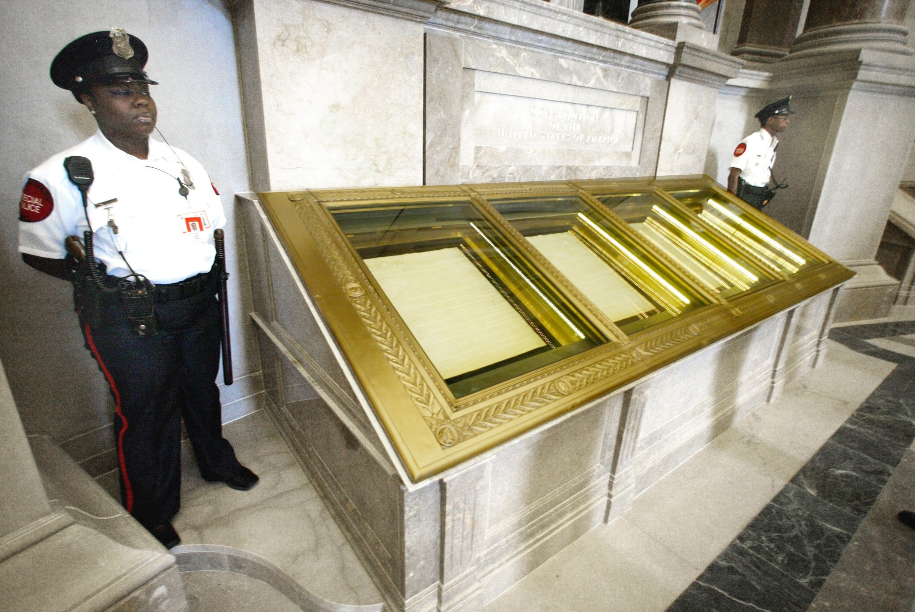 PHOTO: In this Sept. 16, 2003, file photo, guards stand next to the U.S. Constitution in the Rotunda of the National Archives in Washington, D.C.