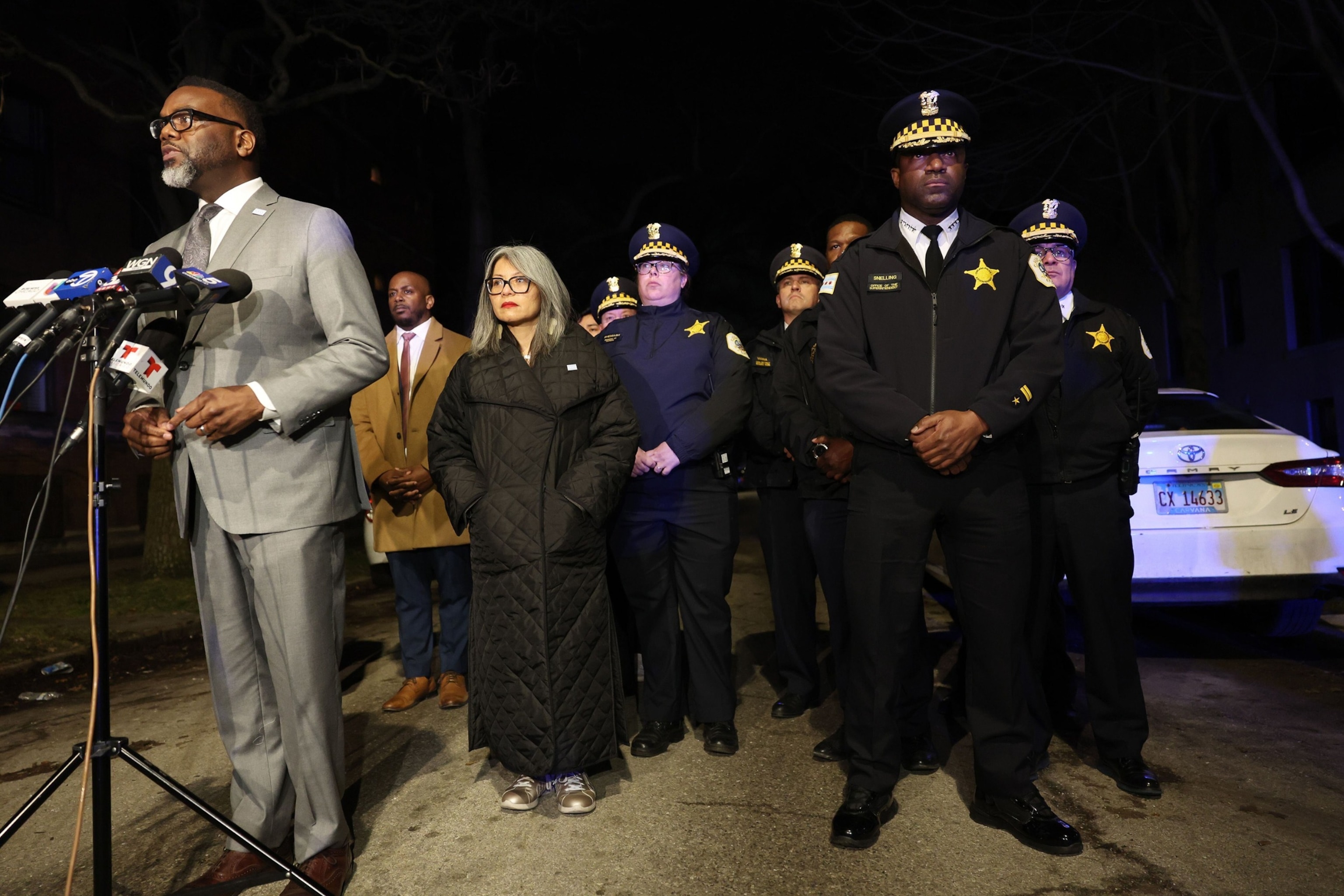 PHOTO: Mayor Brandon Johnson, left, addresses reporters as Chicago police Superintendent Larry Snelling, second from right, listens during a news briefing near the scene where teens were shot, one fatally, Jan. 31, 2024, in Chicago. 