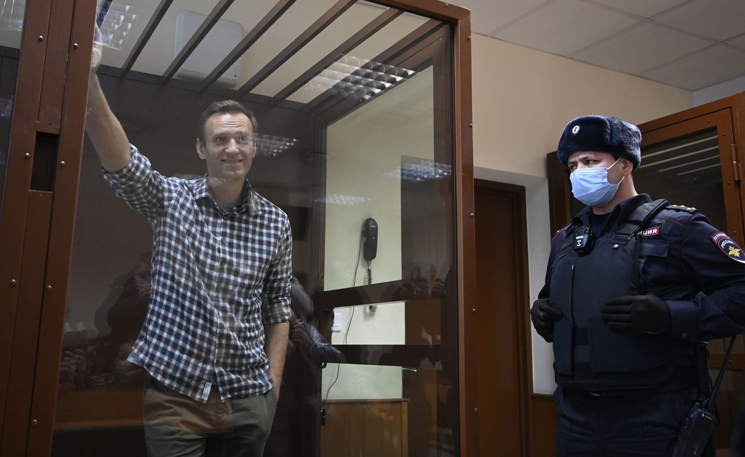 PHOTO: In this Feb. 20, 2021, file photo, Russian opposition leader Alexei Navalny stands inside a glass cell during a court hearing at the Babushkinsky district court in Moscow.