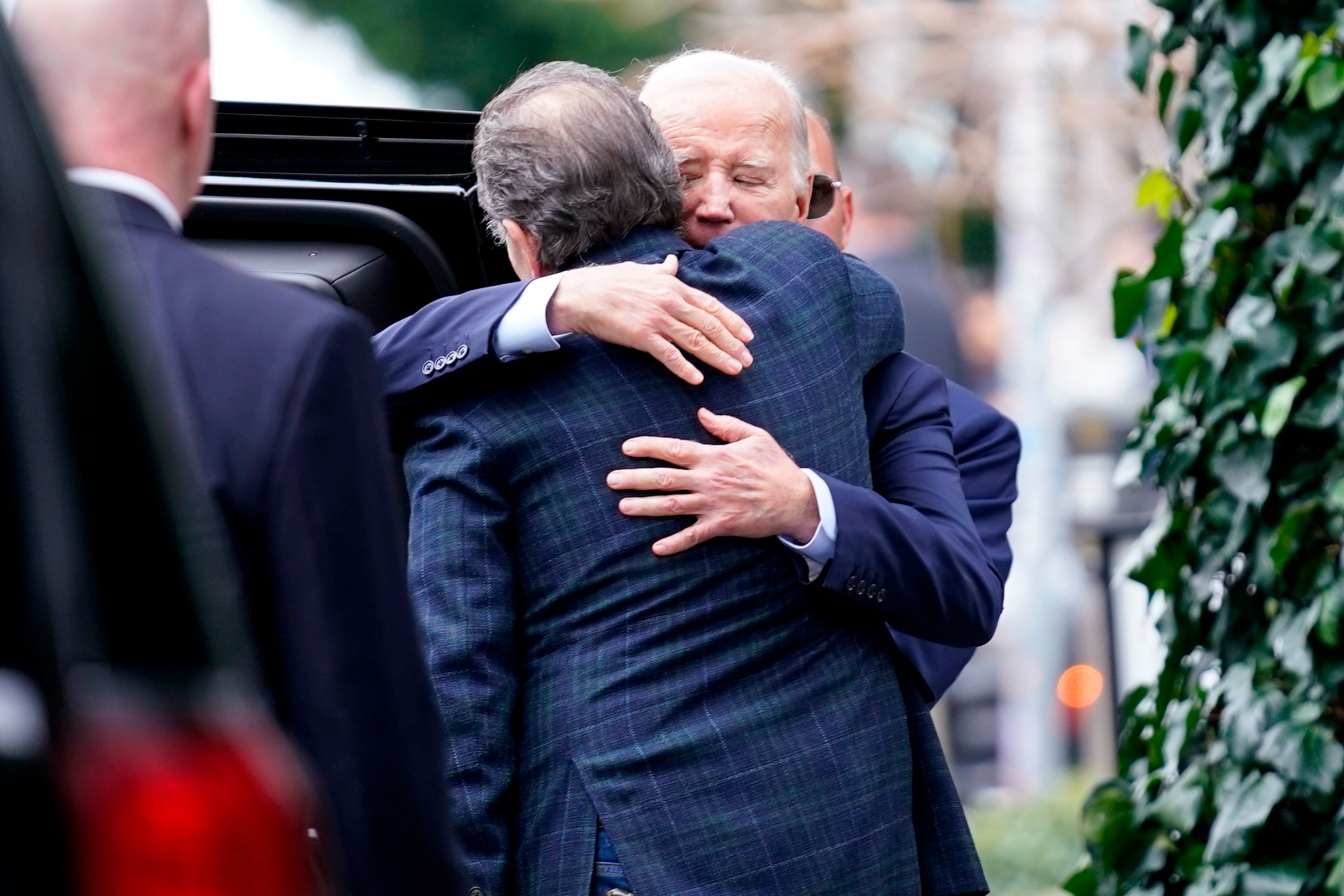 PHOTO: President Joe Biden, right, hugs his son Hunter Biden on Hunter's birthday after dining at The Ivy in Los Angeles, Sunday, Feb. 4, 2024.