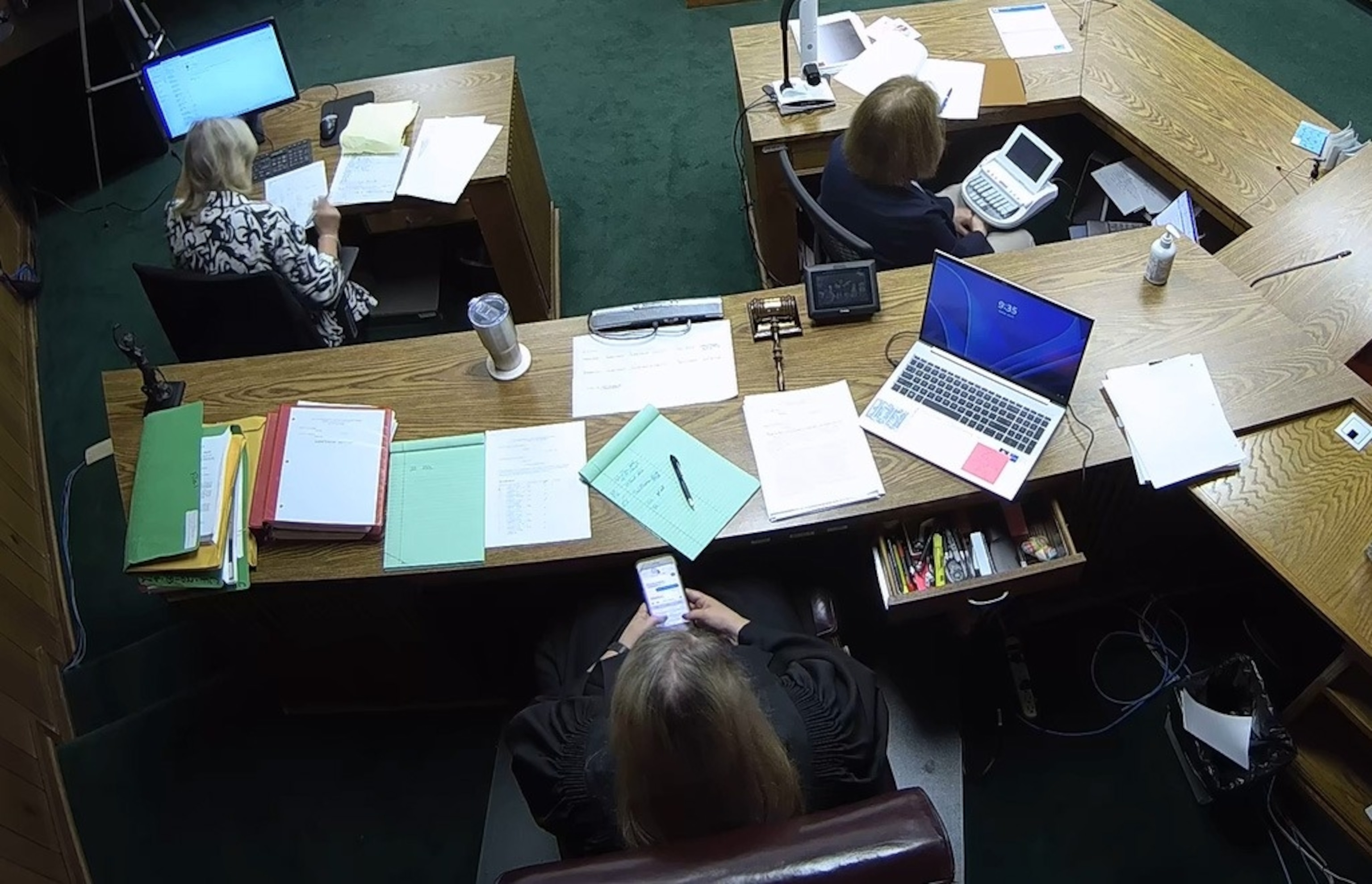 PHOTO: Then-Lincoln County District Judge Traci Soderstrom is seen looking at her cellphone during a murder trial on June 8, 2023, in this still image from security camera video.