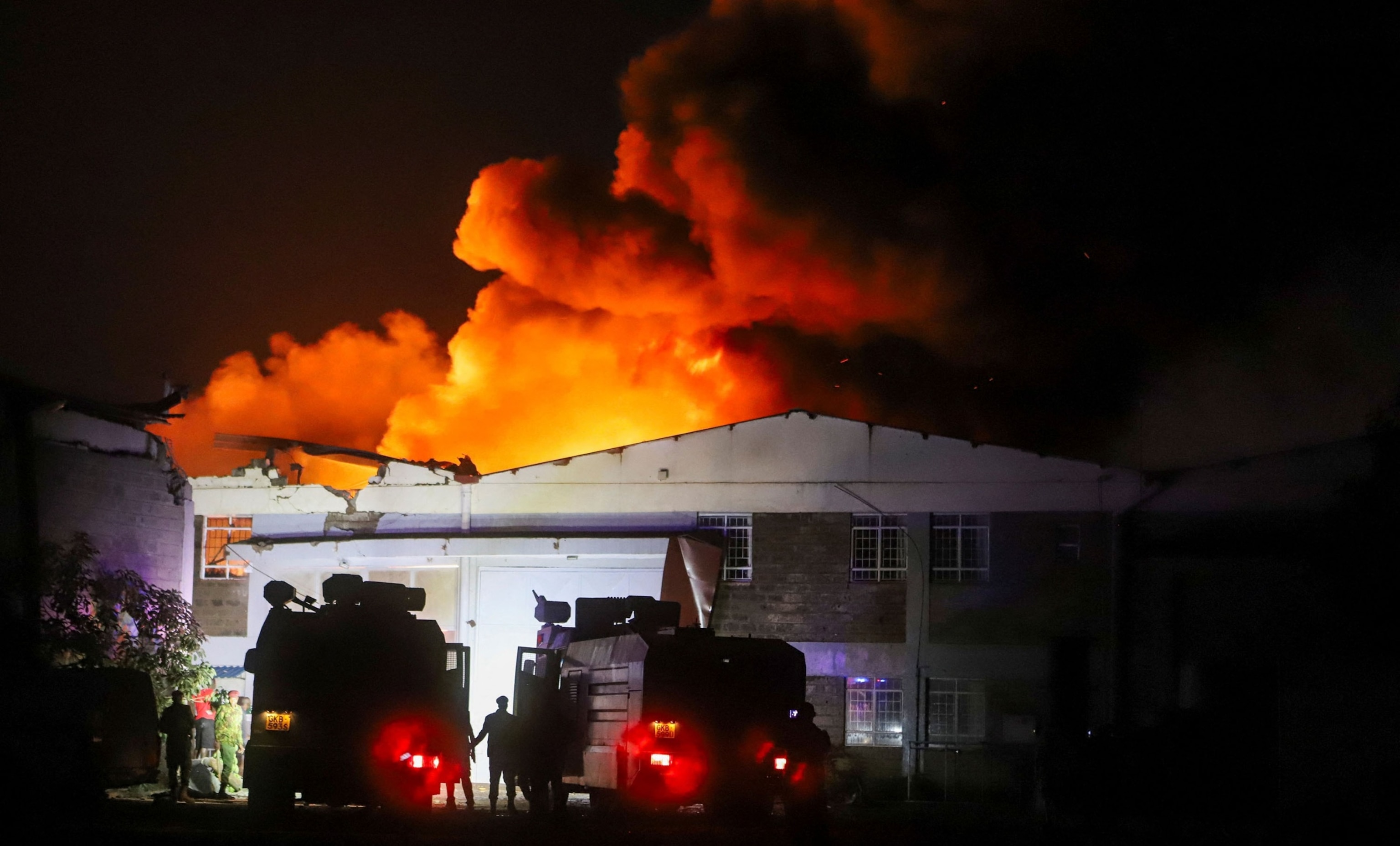 PHOTO: Military firefighters gather near the scene of an explosion at a makeshift gas cylinder refilling depot in Mradi estate, Embakasi district, in Nairobi, Kenya, on Feb. 2, 2024. 