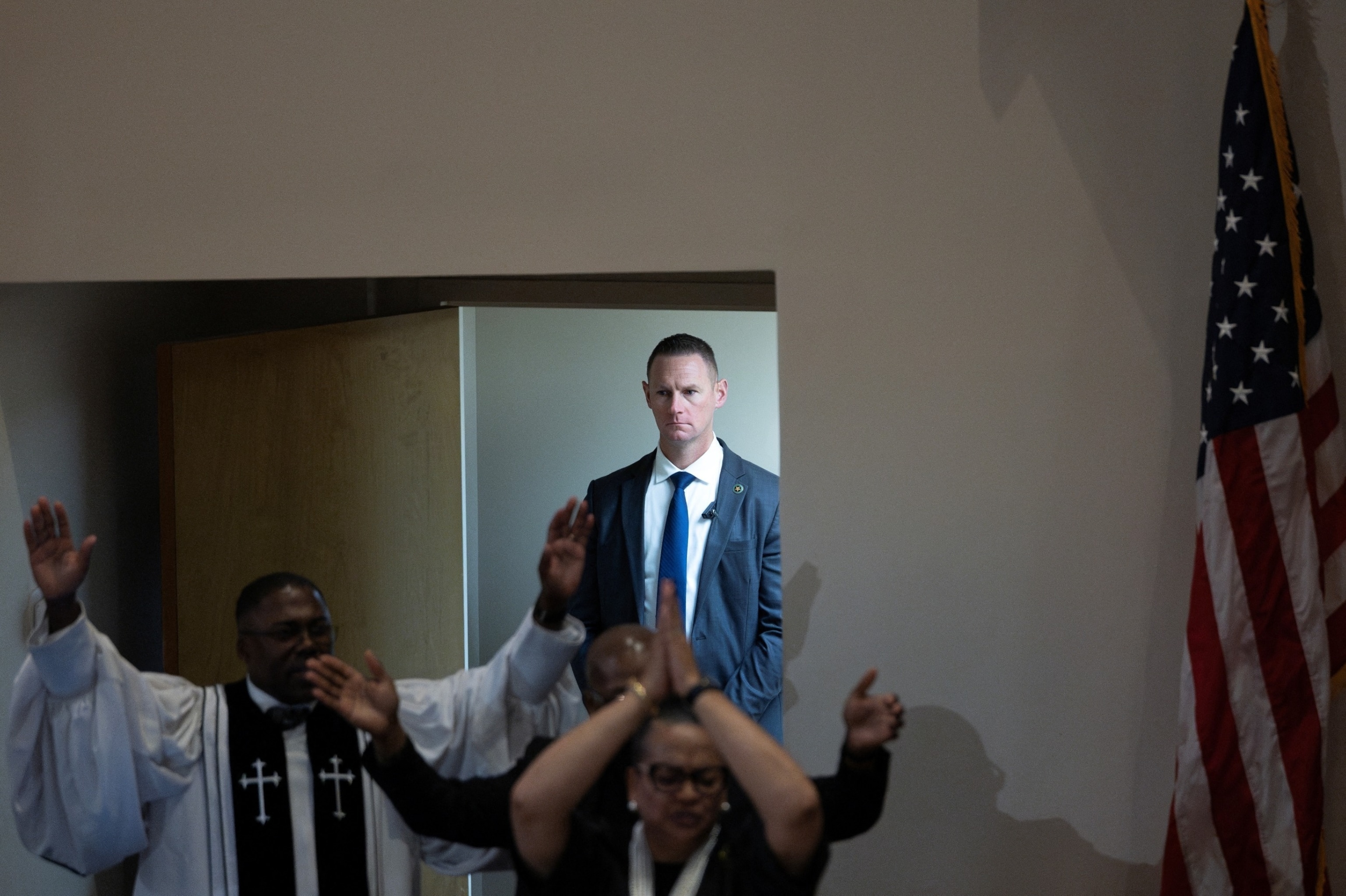 PHOTO: A U.S. Secret Service Agent stands guard as parishioners participate in a song, as U.S. President Joe Biden attends church service at Saint John Baptist Church in West Columbia, South Carolina, Jan. 28, 2024. 