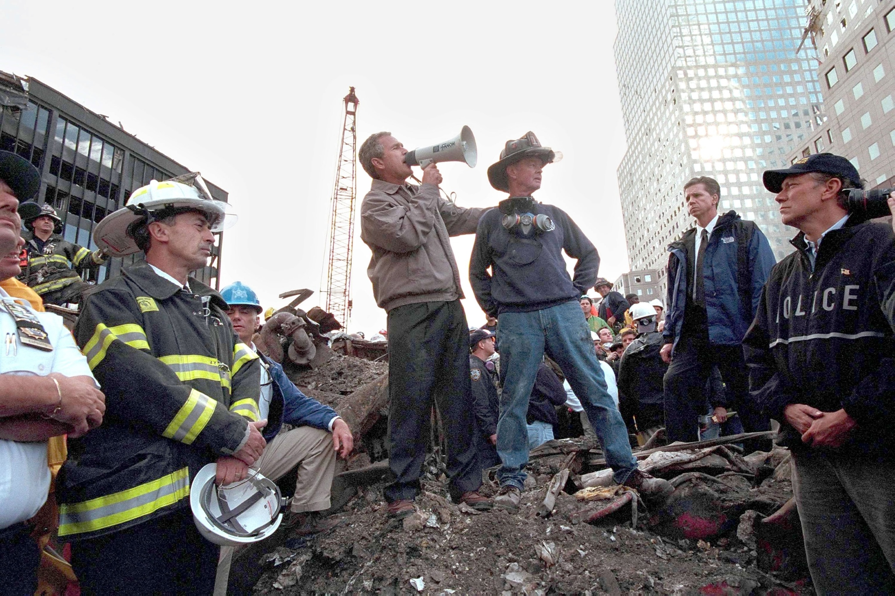 PHOTO: President George W. Bush speaks to rescue workers, firefighters and police officers from the rubble of Ground Zero September 14, 2001 in New York City.