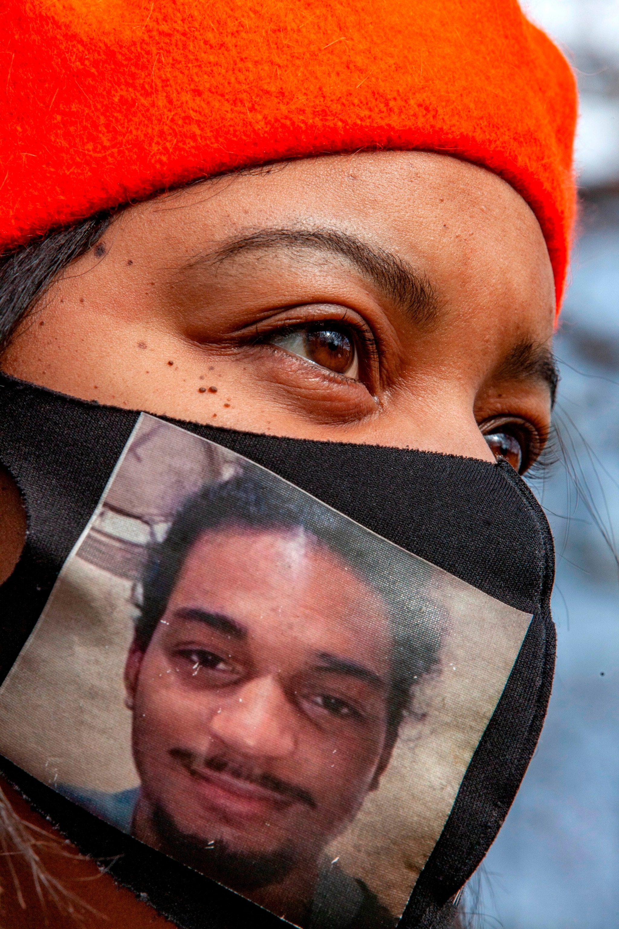 PHOTO: In this Jan. 30, 2021, file photo, activist Karla Harris, a member of the Mothers of Murdered Columbus Children, is seen wearing a facemask with a picture of Casey Goodson Jr., during a protest. 