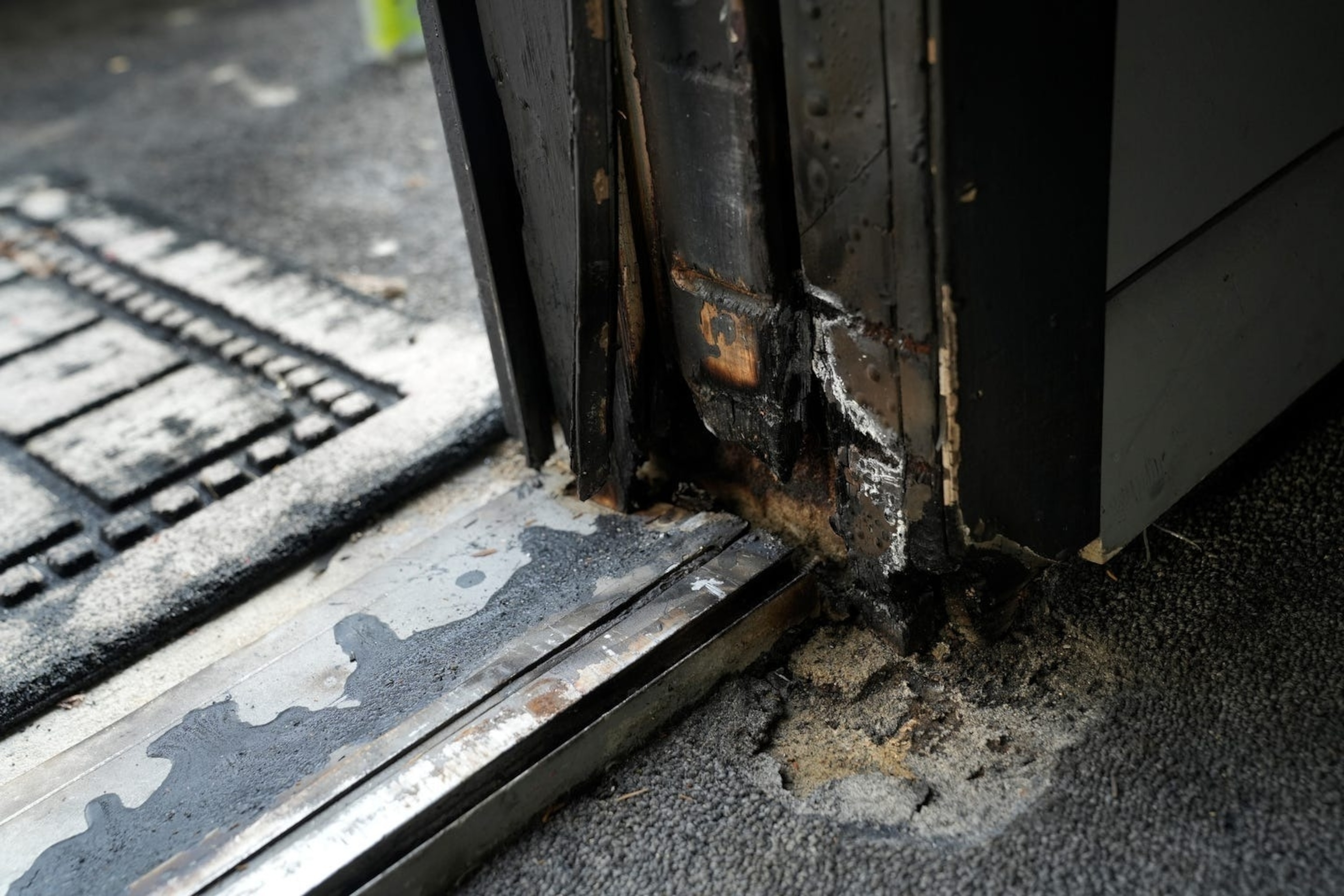 PHOTO: Damage seen on one of the doorways seen a day after a fire at the Shiloh Gospel Temple in North Providence, R.I., Feb. 12, 2024.