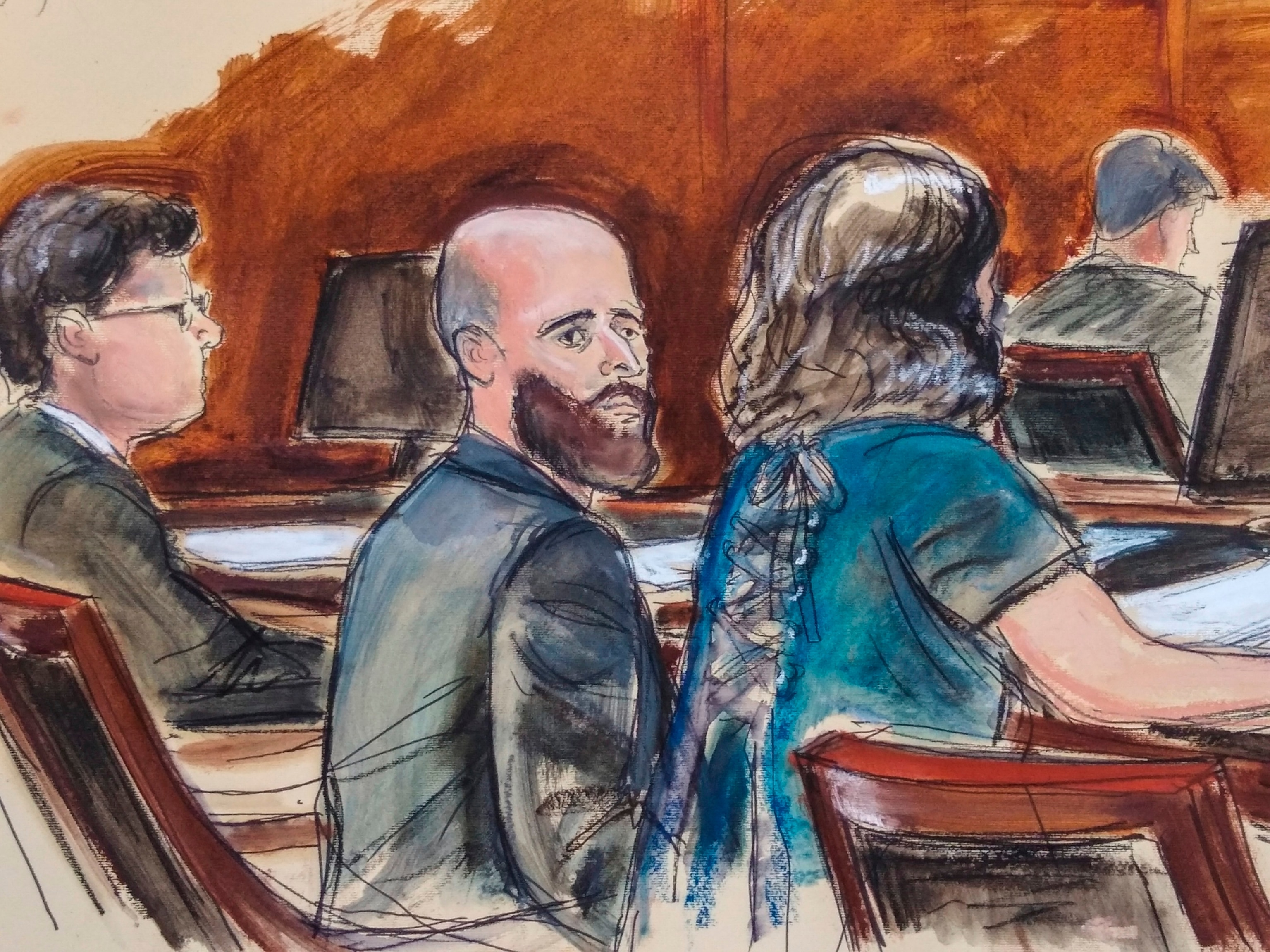 PHOTO: In this courtroom sketch, Joshua Schulte, center, is seated at the defense table flanked by his attorneys during jury deliberations, March 4, 2020, in New York.