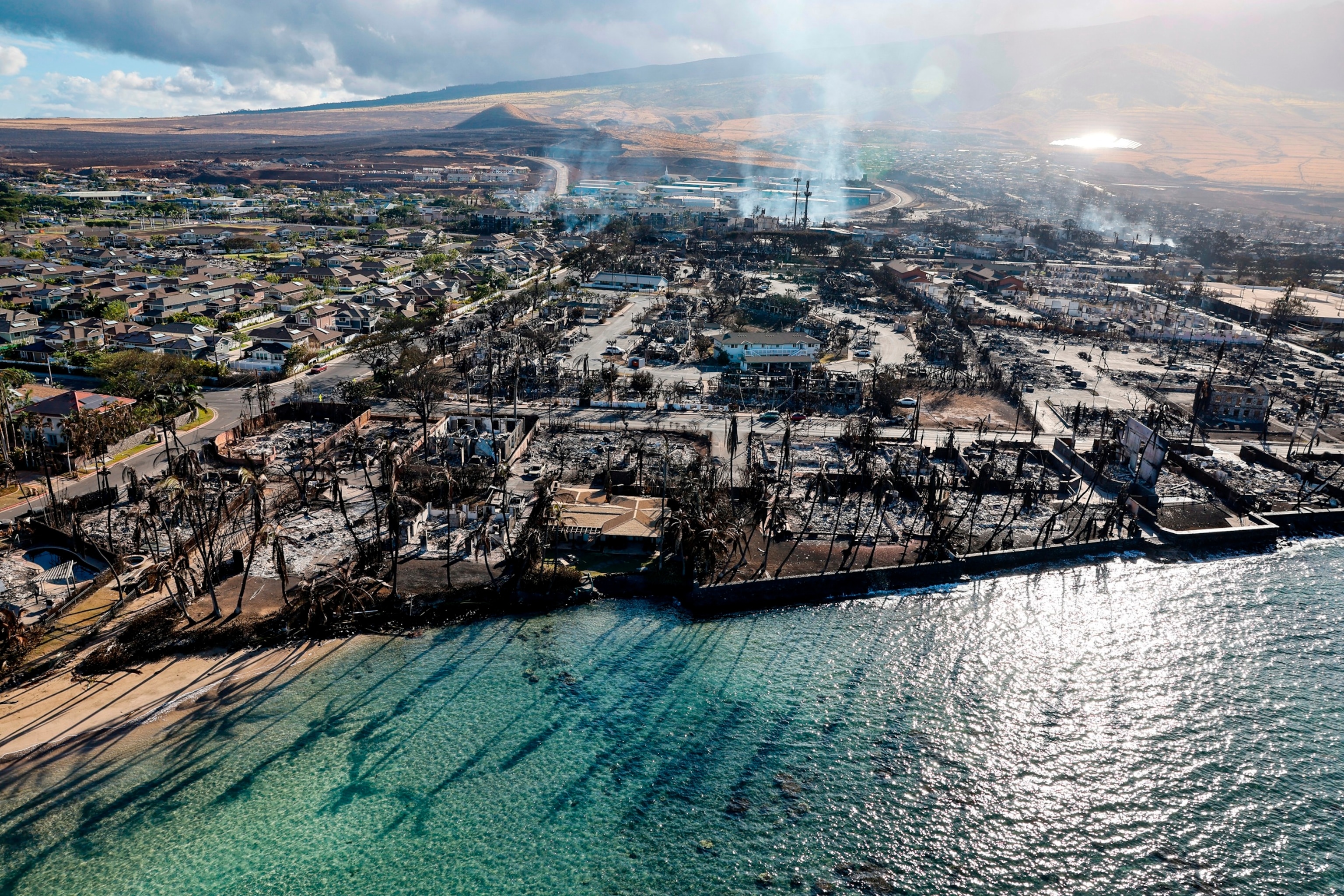 PHOTO: In this Aug. 11, 2023 file photo, buildings still smolder days after a wildfire gutted downtown Lahaina, Hawaii. 