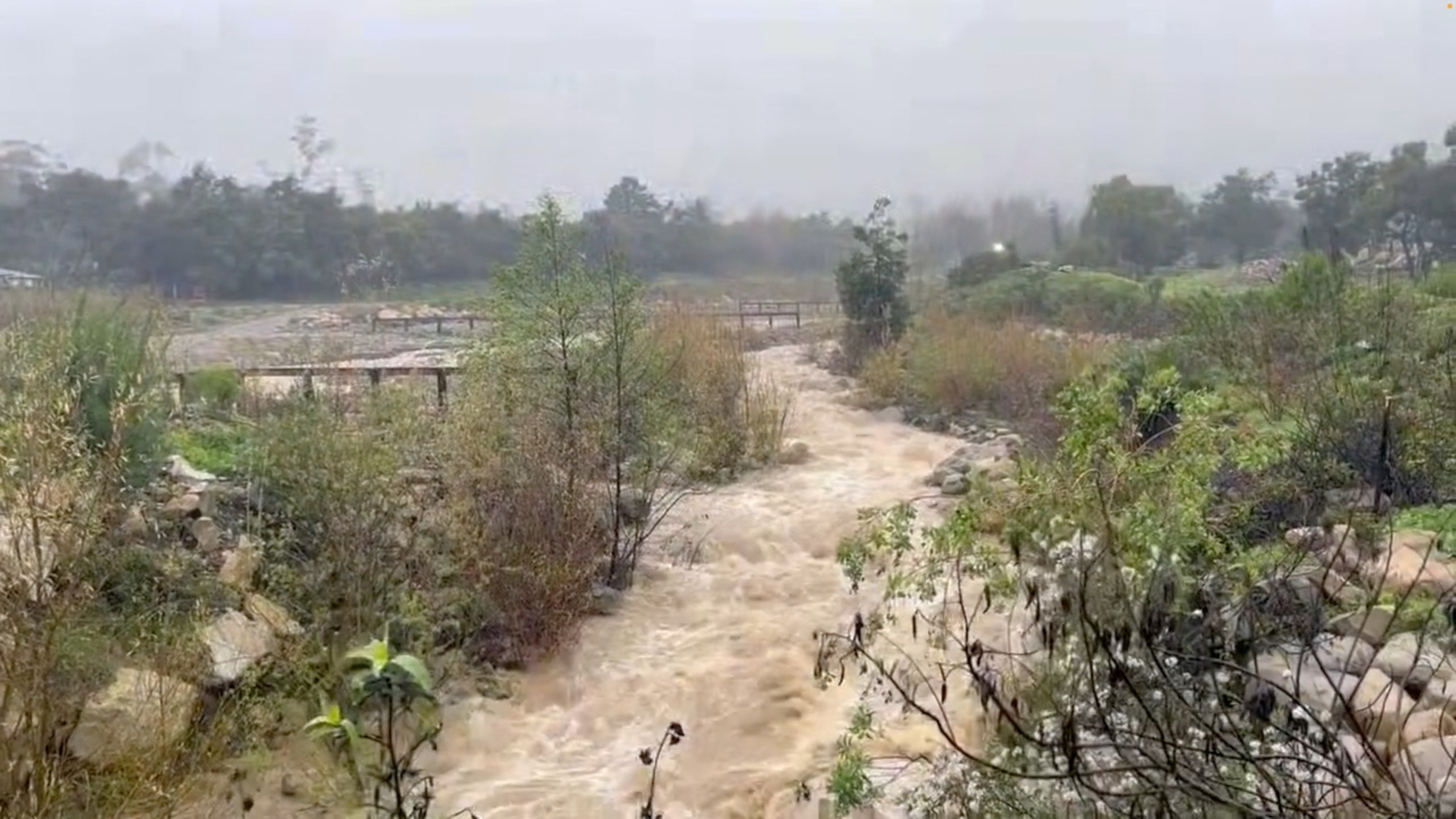 PHOTO: Flood water gushes through San Ysidro Creek at the Randall debris basin, Feb. 19, 2024, in Montecito, Calif.