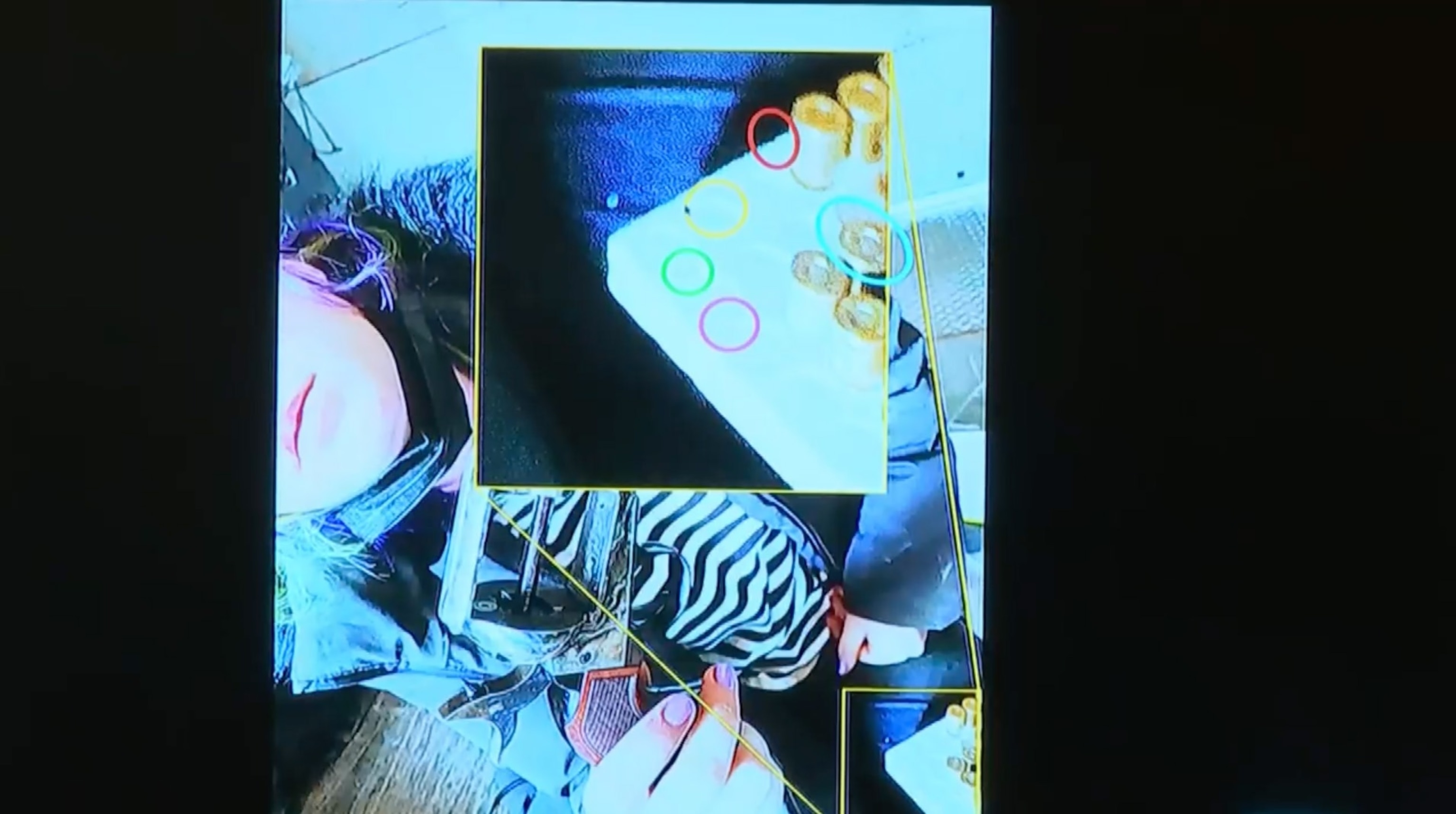 PHOTO: Prosecutors show jurors a photo that they say appears to show a live bullet on the set of "Rust" on Oct. 10, 2021, during opening statements.