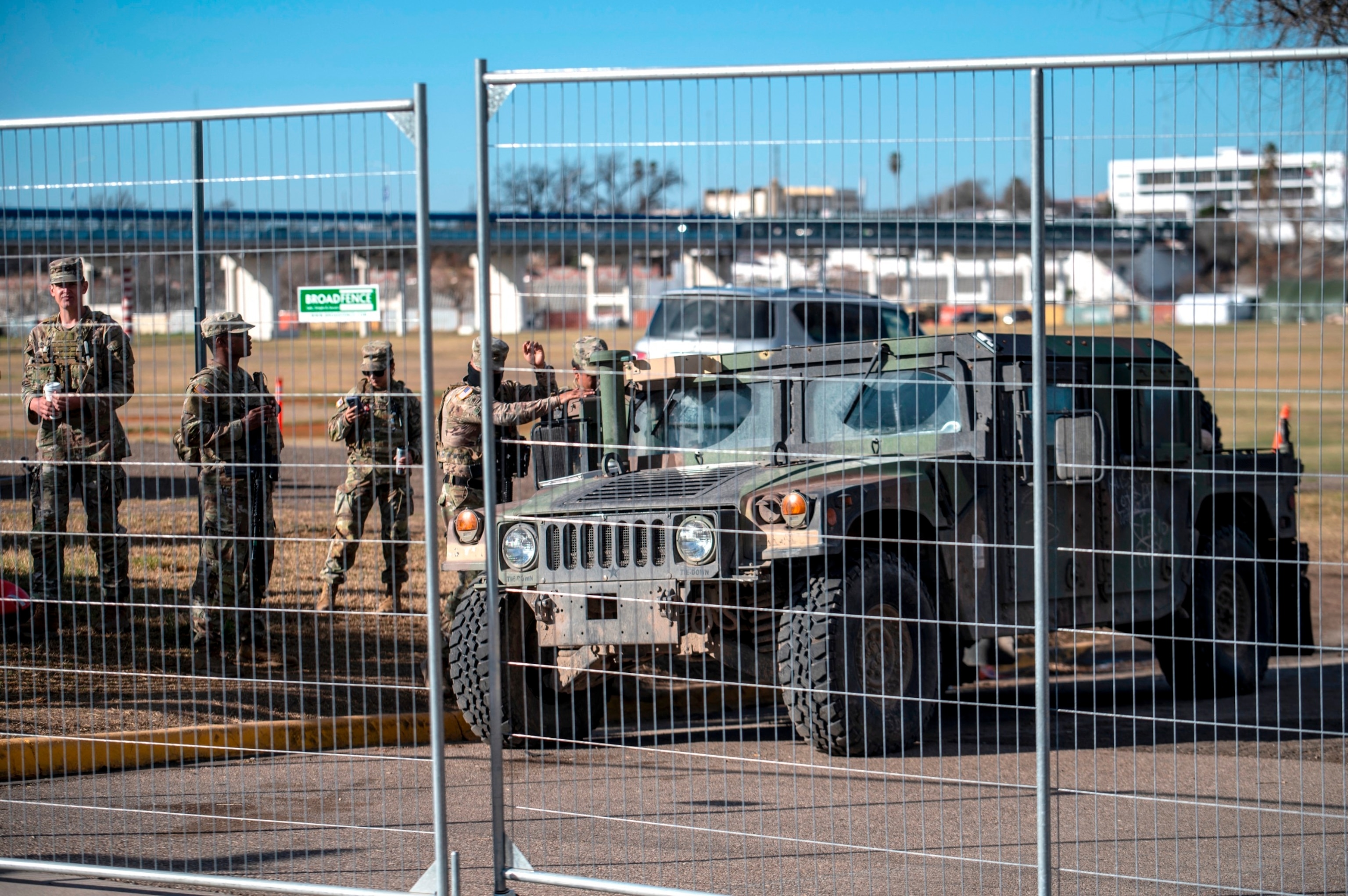 PHOTO: Members of Texas National Guard sit inside the fence at Shelby Park on February 3, 2024 in Eagle Pass, Texas.