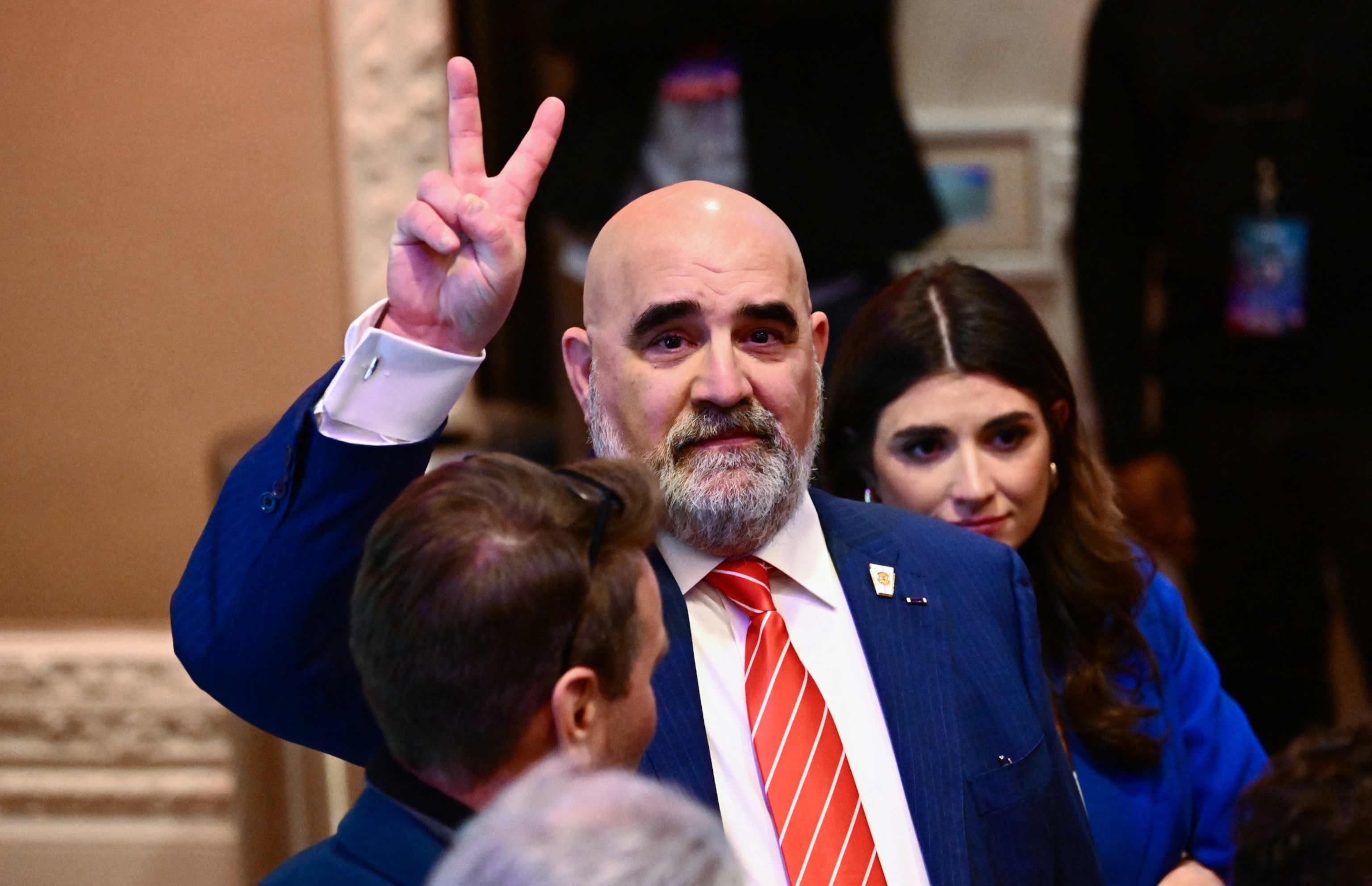 PHOTO:Senior adviser for the Trump campaign Chris LaCivita makes a flashes a V sign during a Caucus Night watch party in Las Vegas, Feb. 8, 2024. 