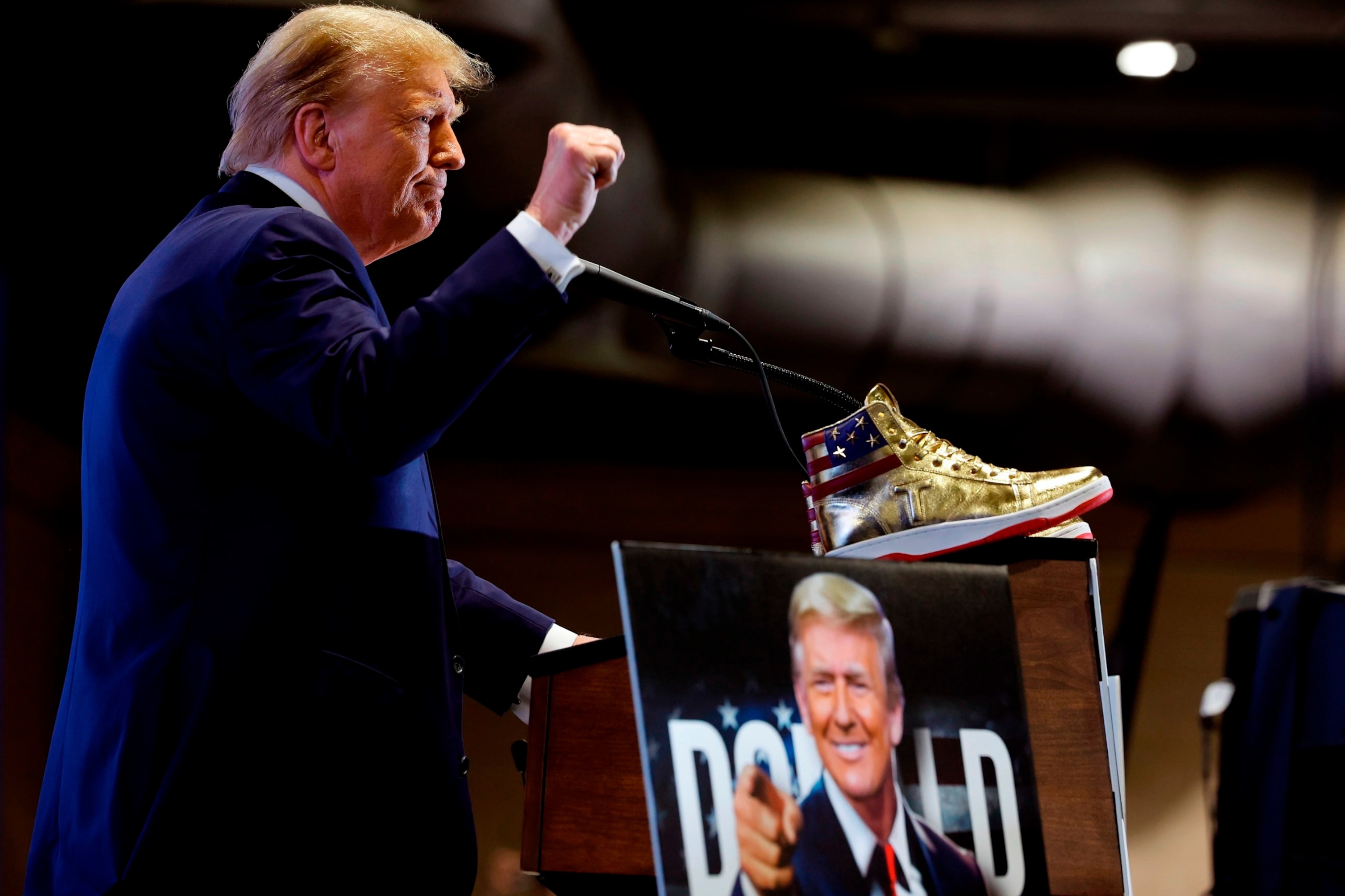 PHOTO: Donald Trump takes the stage to introduce a new line of signature shoes at Sneaker Con at the Philadelphia Convention Center on February 17, 2024 in Philadelphia.