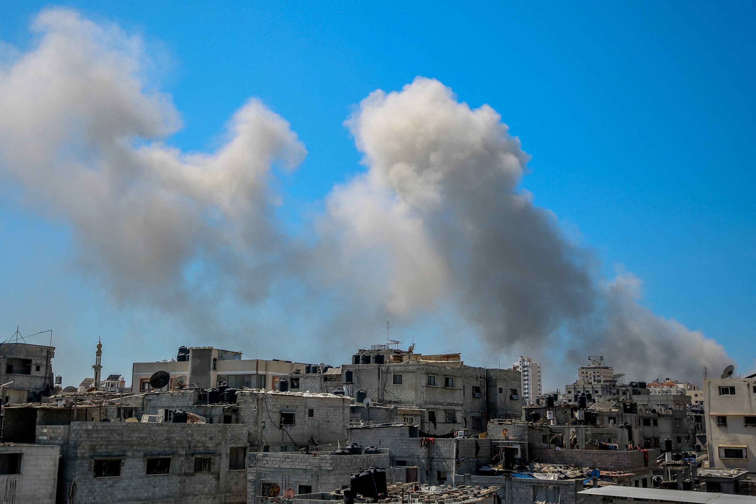 PHOTO: A picture shows smoke billowing after Israeli bombardment in the vicinity of the Al-Shifa hospital in Gaza City on March 23, 2024, amid ongoing battles between Israel and the militant group Hamas.
