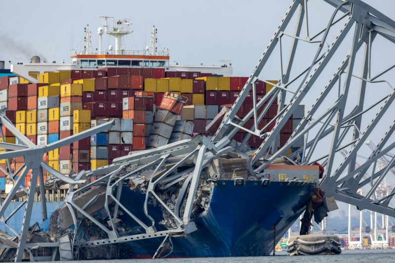 BALTIMORE, MARYLAND - MARCH 26: The cargo ship Dali sits in the water after running into and collapsing the Francis Scott Key Bridge on March 26, 2024 in Baltimore, Maryland. According to reports, rescuers are still searching for multiple people, while two survivors have been pulled from the Patapsco River. A work crew was fixing potholes on the bridge, which is used by roughly 30,000 people each day, when the ship struck at around 1:30am on Tuesday morning. The accident has temporarily closed the Port of Baltimore, one of the largest and busiest on the East Coast of the U.S. (Photo by Tasos Katopodis/Getty Images)