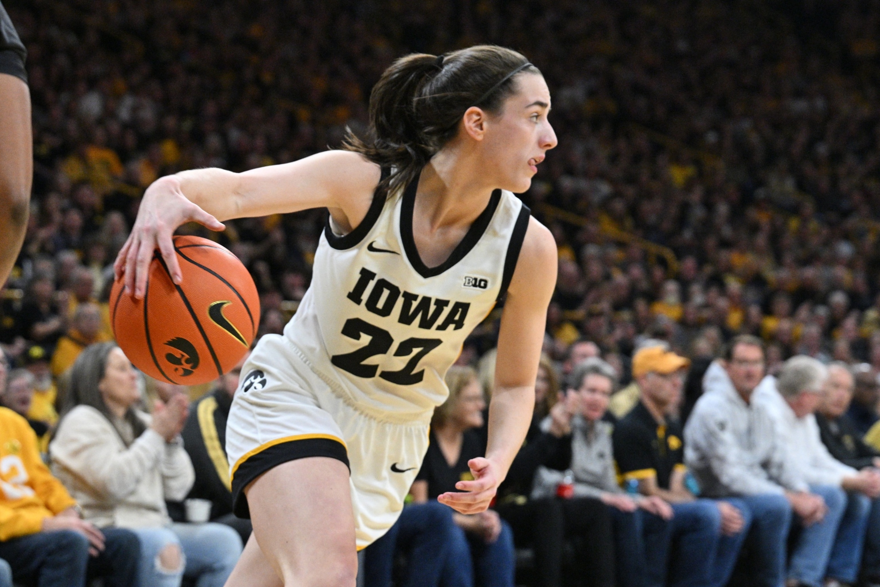 PHOTO: Iowa Hawkeyes guard Caitlin Clark controls the ball during the first quarter against the Ohio State Buckeyes in Iowa City, IA, Mar. 3, 2024.