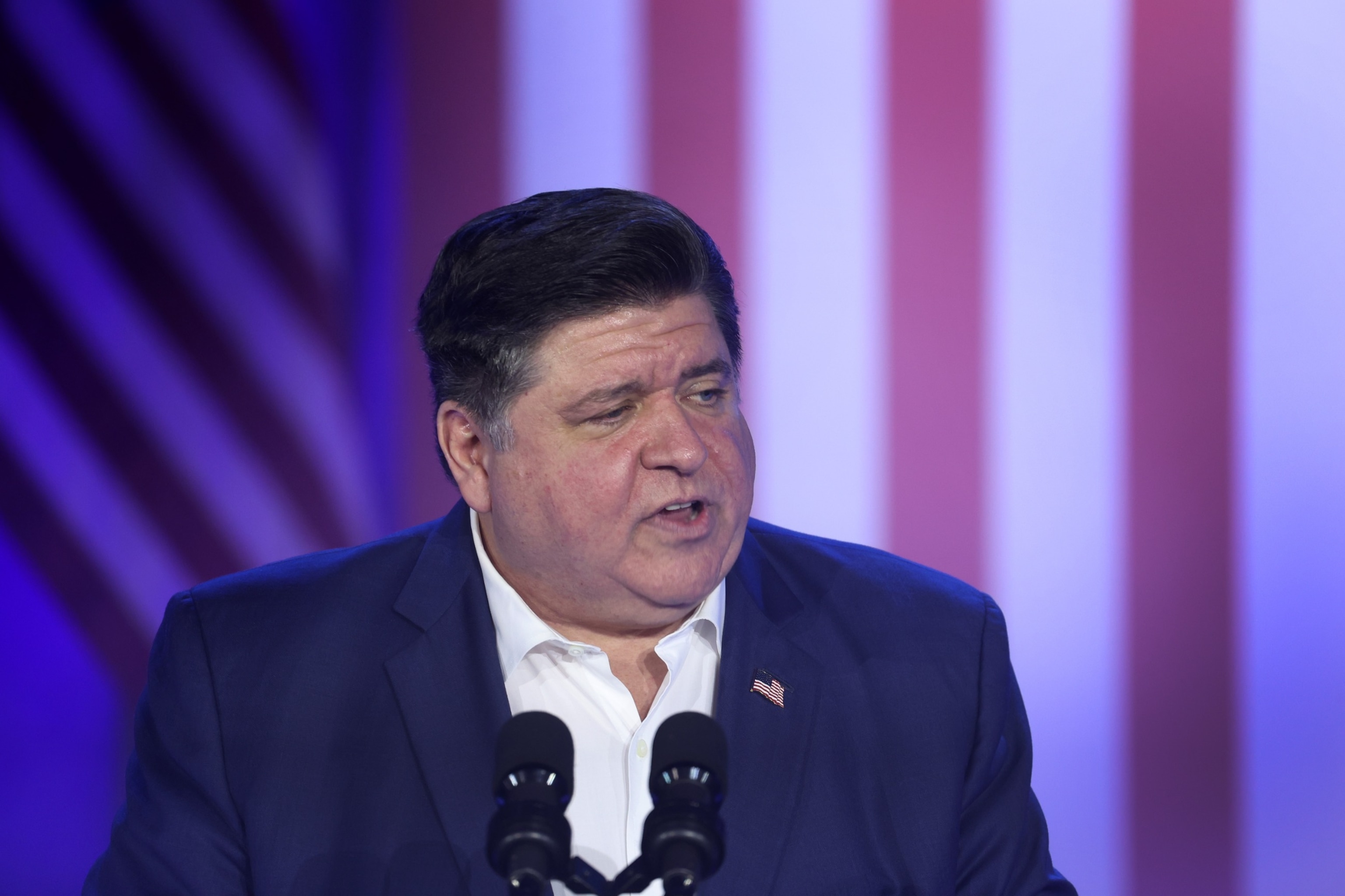 PHOTO: Illinois Gov. J.B. Pritzker speaks to auto workers before the arrival of President Joe Biden at the Community Complex Building, Nov. 9, 2023, in Belvidere, Ill.