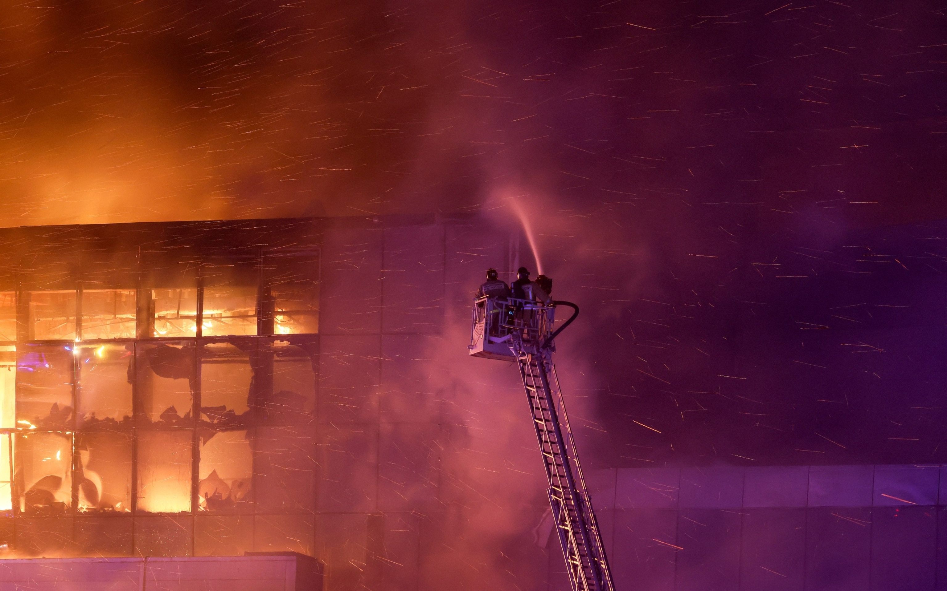 PHOTO: Rescuers work to extinguish fire at the burning Crocus City Hall concert venue following a shooting incident, outside Moscow, Russia, Mar. 22, 2024. 