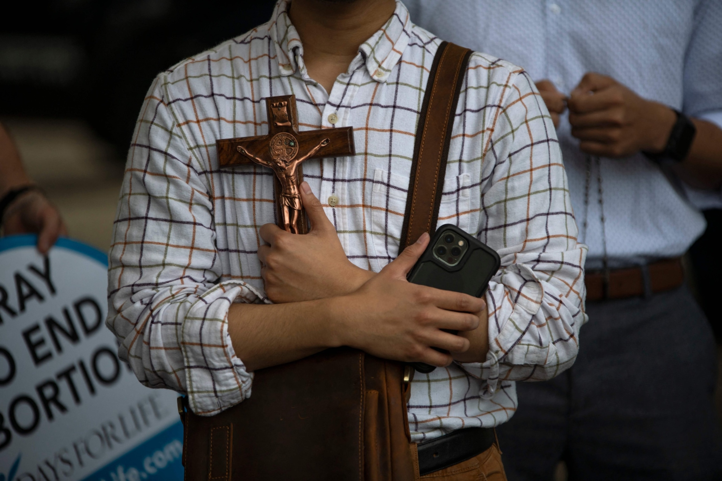 PHOTO: Anti-abortion protesters pray as demonstrators gather outside City Hall during a Bans Off Our Bodies rally in Houston, TX, on May 14, 2022. 