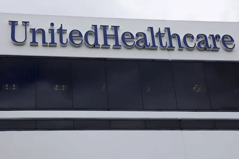 The corporate logo of the UnitedHealth Group appears on the side of one of their office buildings in Santa Ana, California, U.S., April 13, 2020. REUTERS/Mike Blake/File Photo