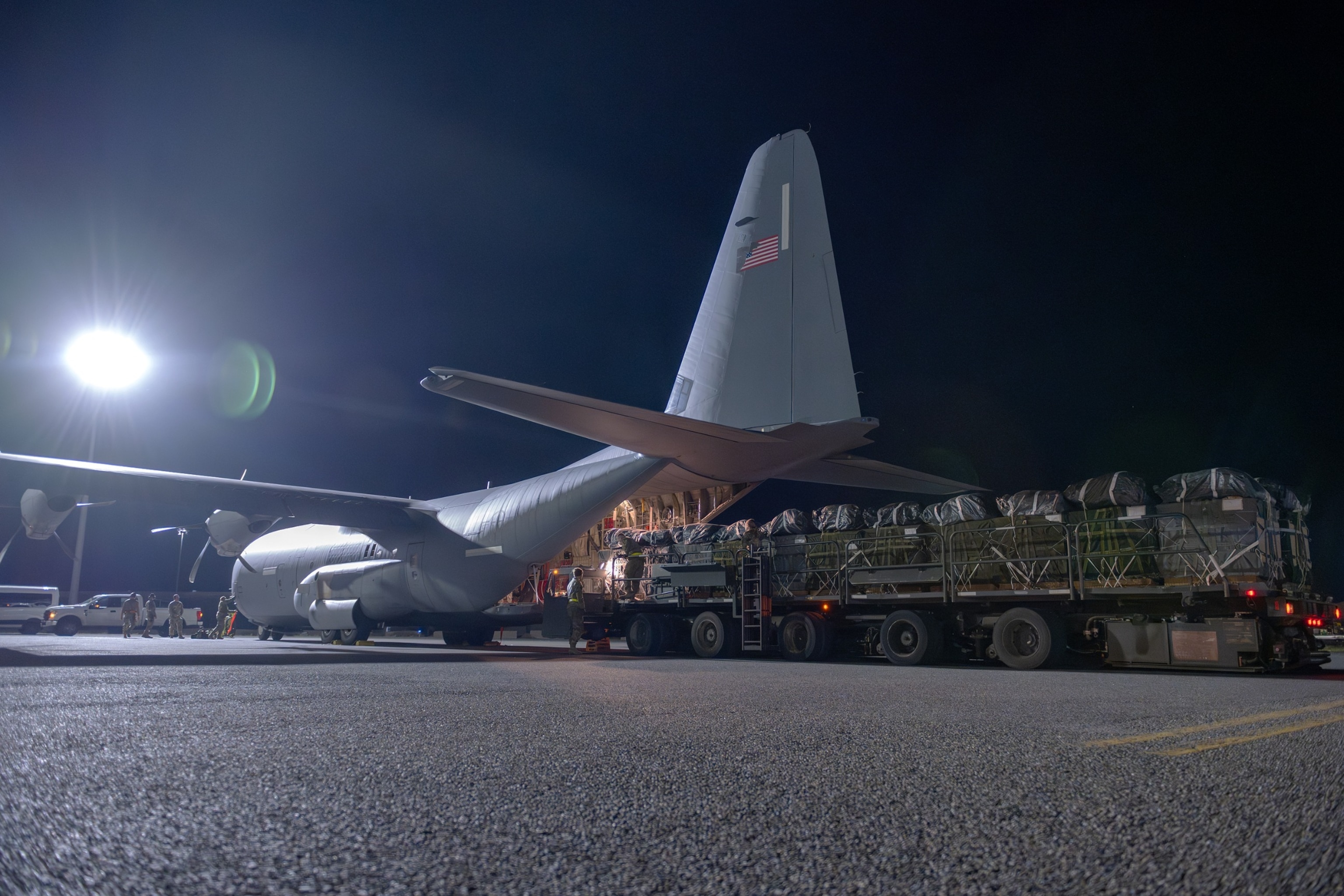 PHOTO: A U.S. Air Force C-130J Super Hercules deployed to an undisclosed location in the U.S. Central Command area of responsibility, is loaded with humanitarian aid destined for an airdrop over Gaza, on March 5, 2024. 