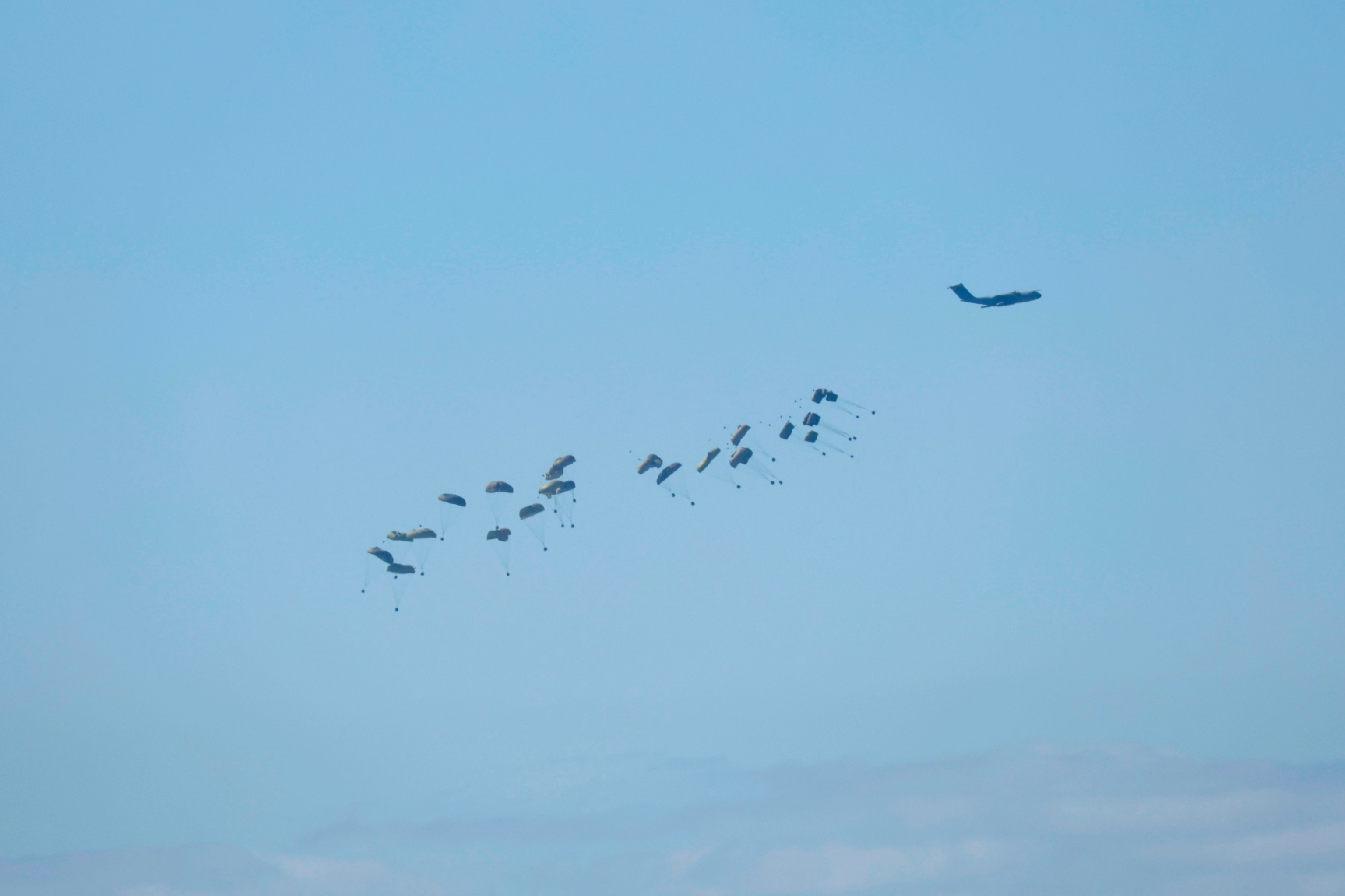 PHOTO: An Air drop over Gaza as seen from a position on the Israeli side of the border, in southern Israel, Mar. 10, 2024.