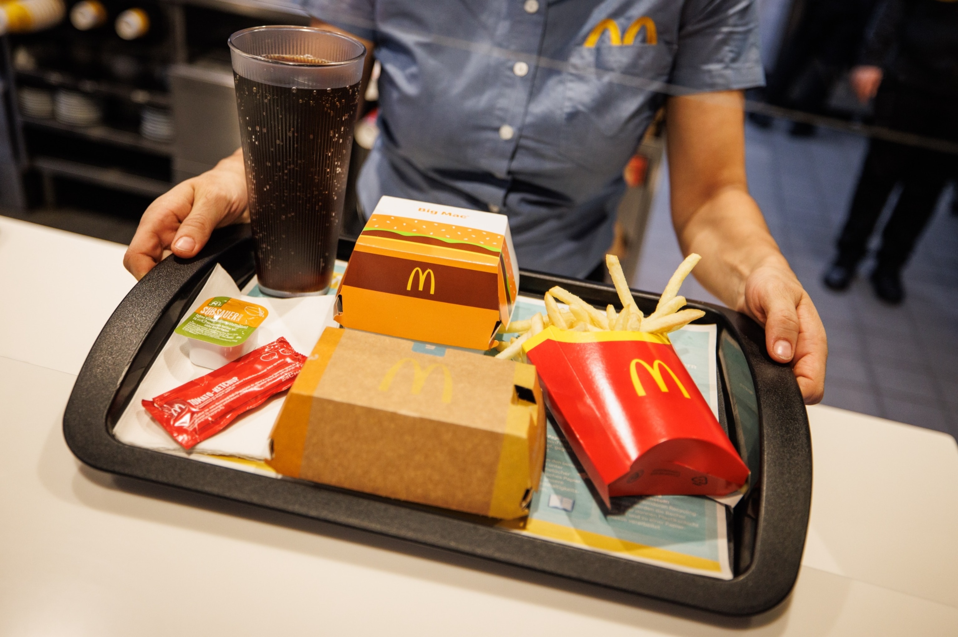 PHOTO: An employee hands over a tray at a McDonald's, Dec. 2, 2021, in Bavaria, Munich.