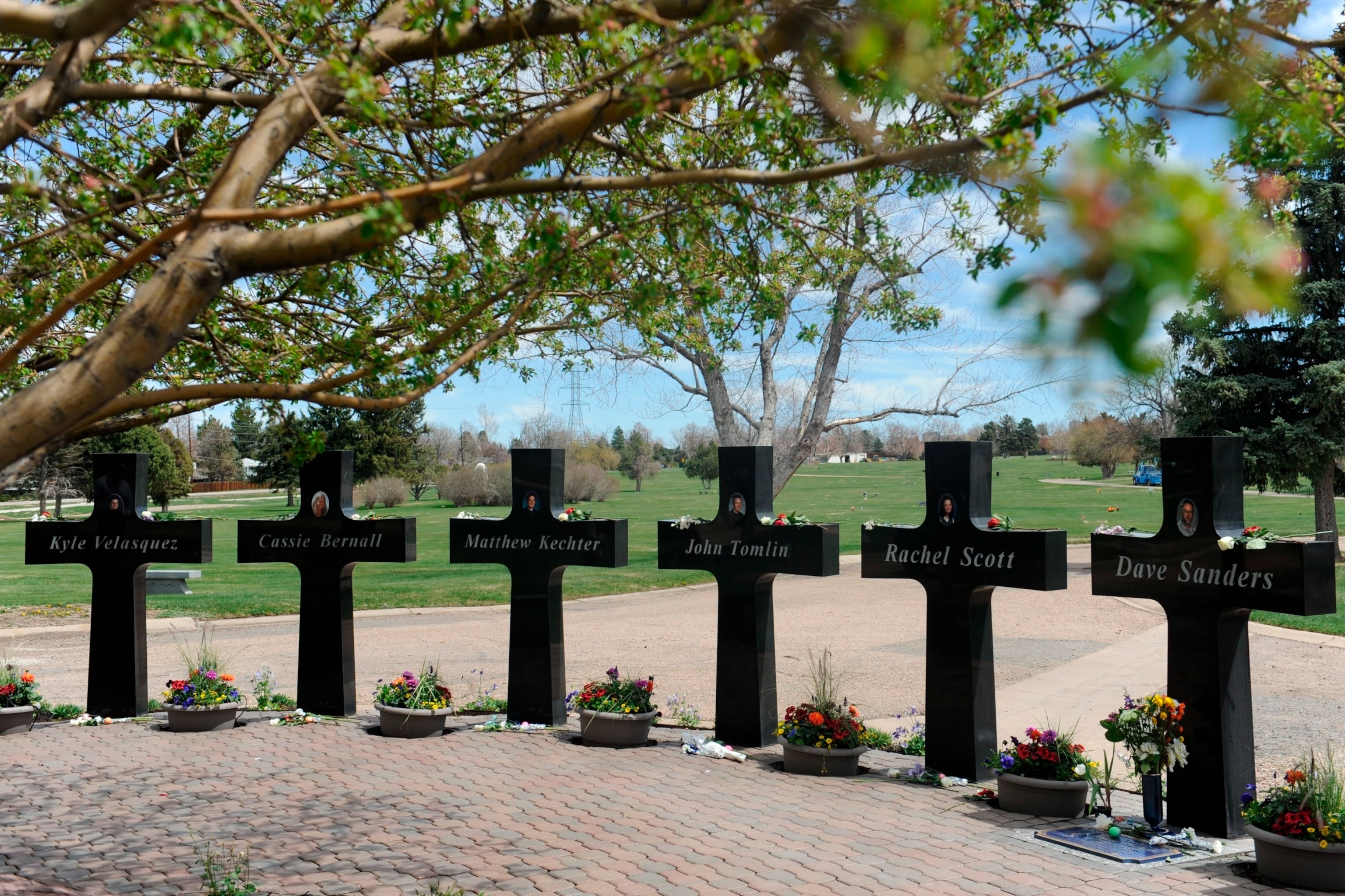 PHOTO: Crosses with the names and portraits of the victims of the 1999 Columbine High School massacre are seen at the Chapel Hill Memorial Gardens in Littleton, Colorado, April 20, 2019. 