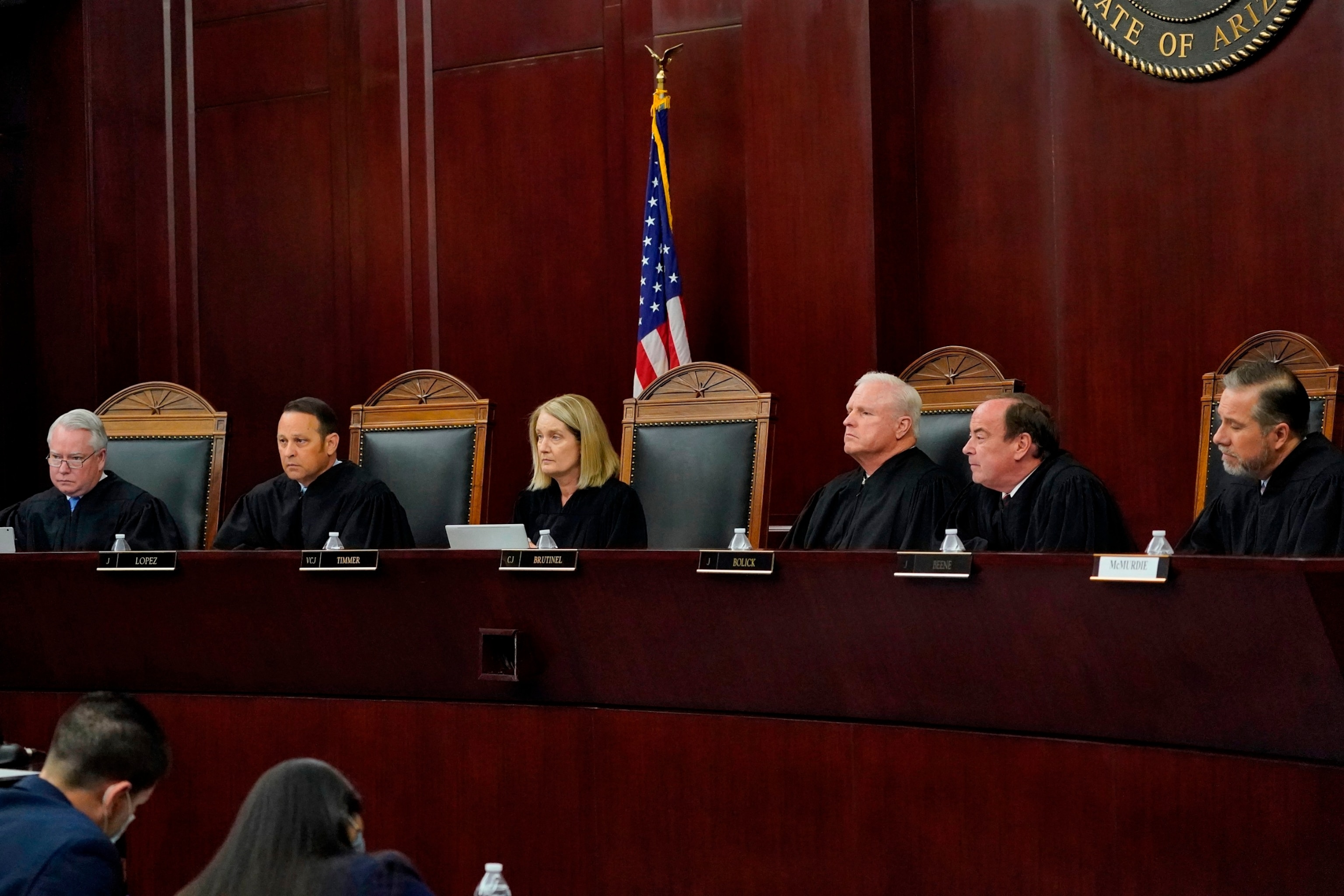 PHOTO: Arizona Supreme Court Justices from left; William G. Montgomery, John R Lopez IV, Vice Chief Justice Ann A. Scott Timmer, Chief Justice Robert M. Brutinel, Clint Bolick and James Beene listen to oral arguments on April 20, 2021, in Phoenix.