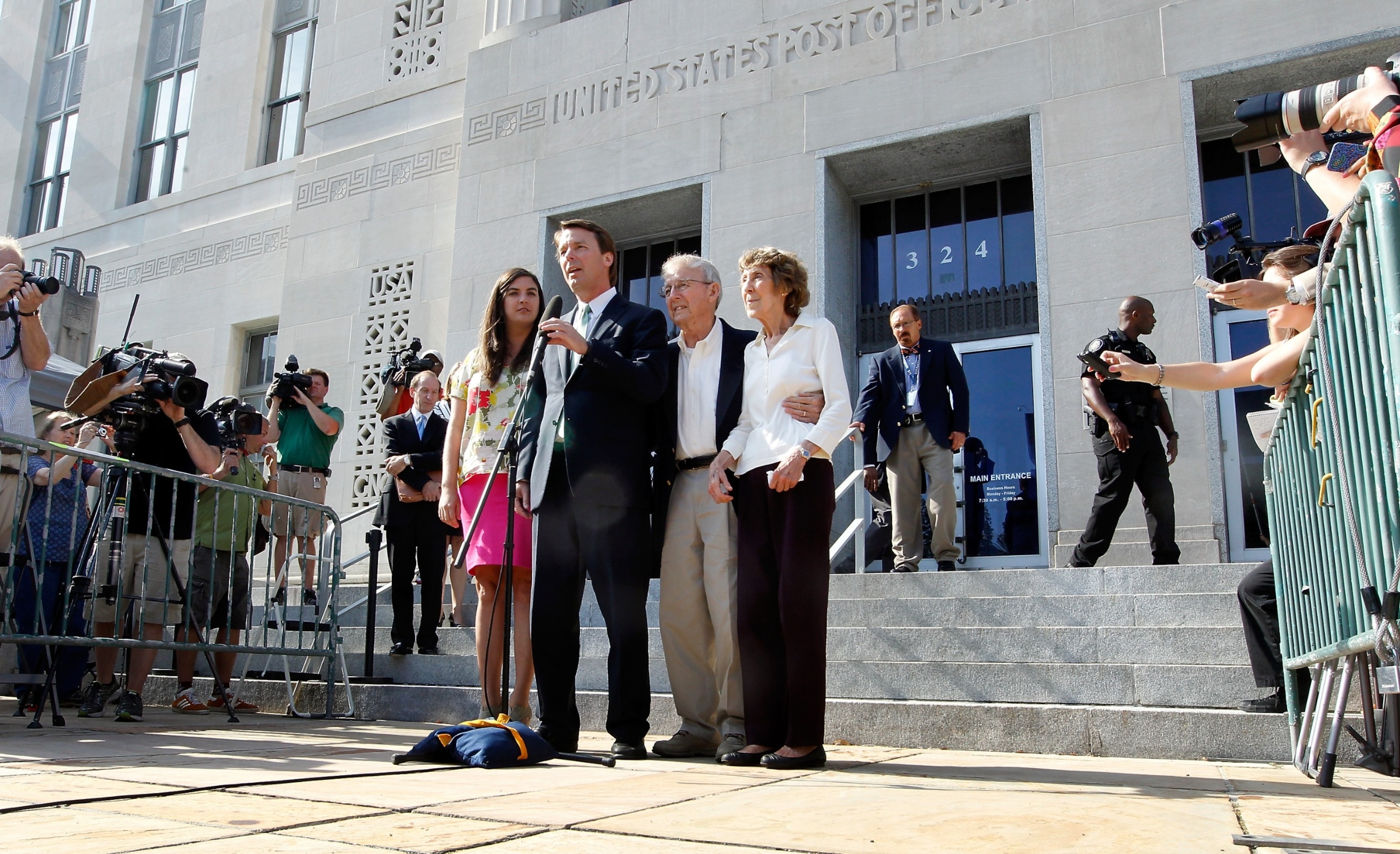 PHOTO: Former U.S. Sen. John Edwards addresses the media alongside his daughter Cate Edwards (L) and his parents Wallace and Bobbie Edwards at the federal court May 31, 2012 in Greensboro, North Carolina.