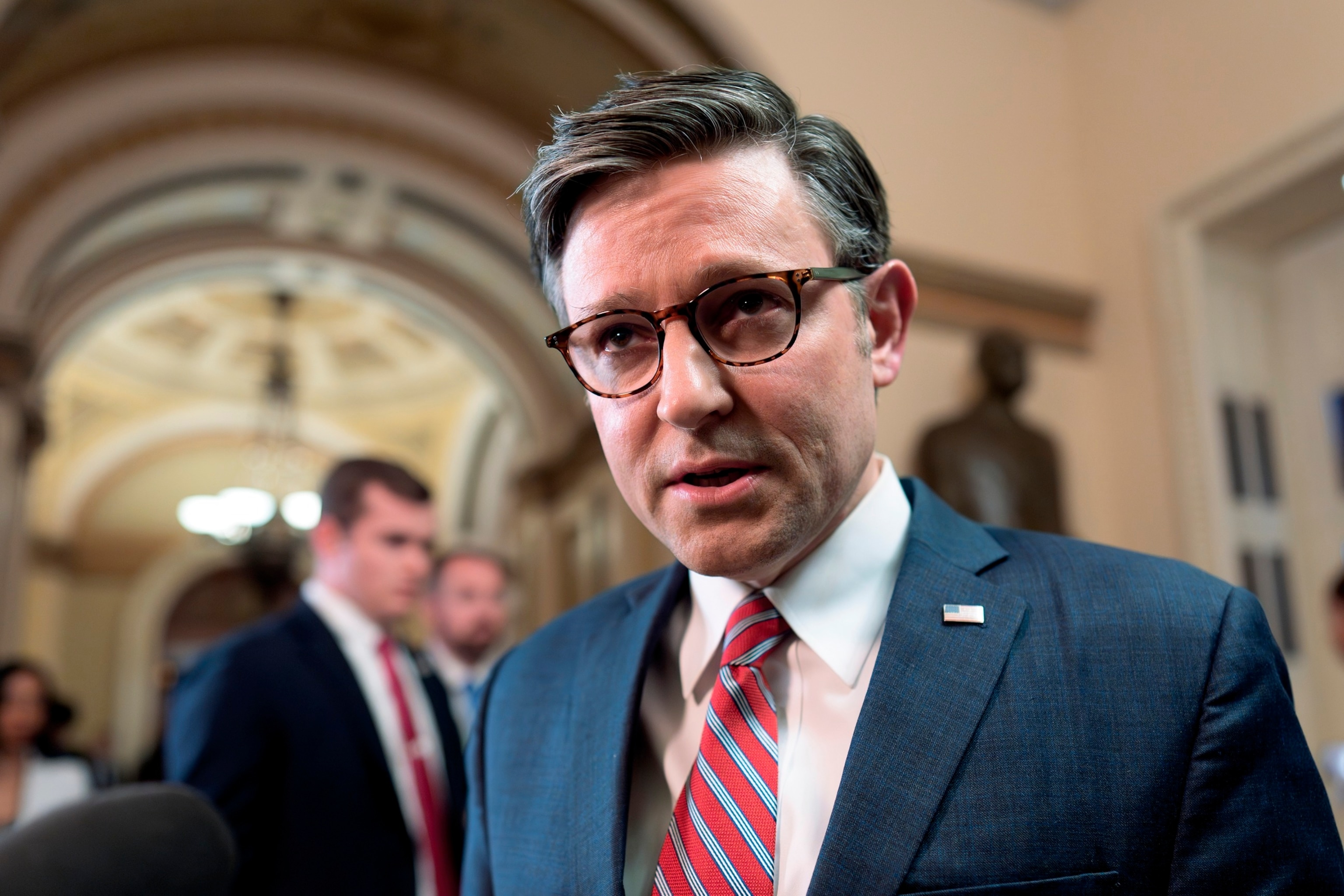 PHOTO: Speaker of the House Mike Johnson talks to reporters just after lawmakers pushed a $95 billion national security aid package for Ukraine, Israel and other U.S. allies closer to passage, at the Capitol, April 19, 2024.