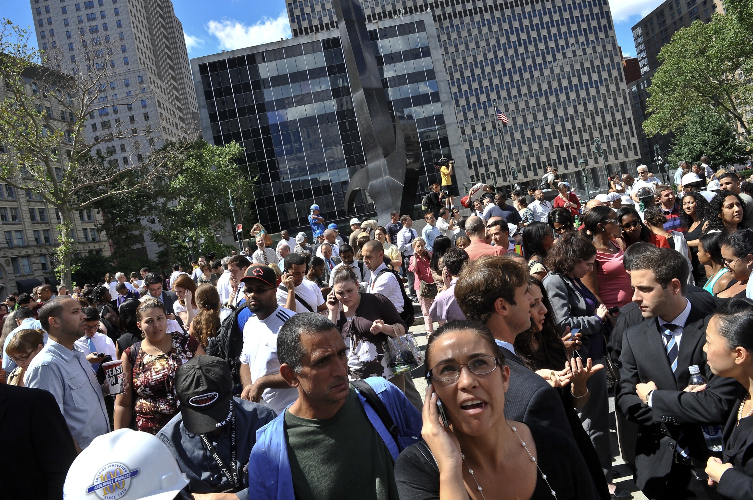 PHOTO: People stand in a square outside the courthouse after an earthquake was felt in New York City, Aug. 23, 2011.