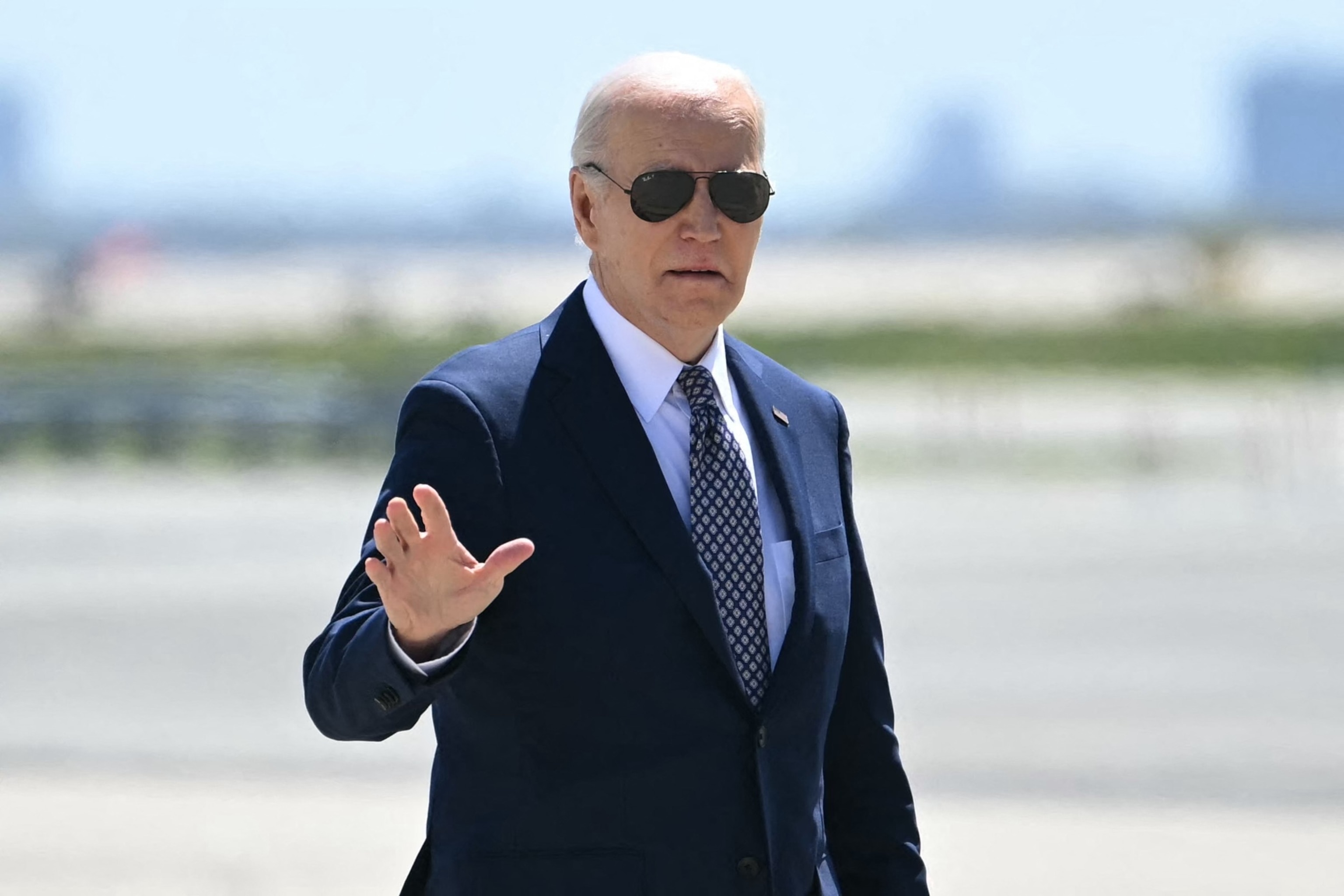 PHOTO: President Joe Biden waves as he walks to board Air Force One as he transits through John F. Kennedy International Airport, April 26, 2024, on his way back to the White House. 