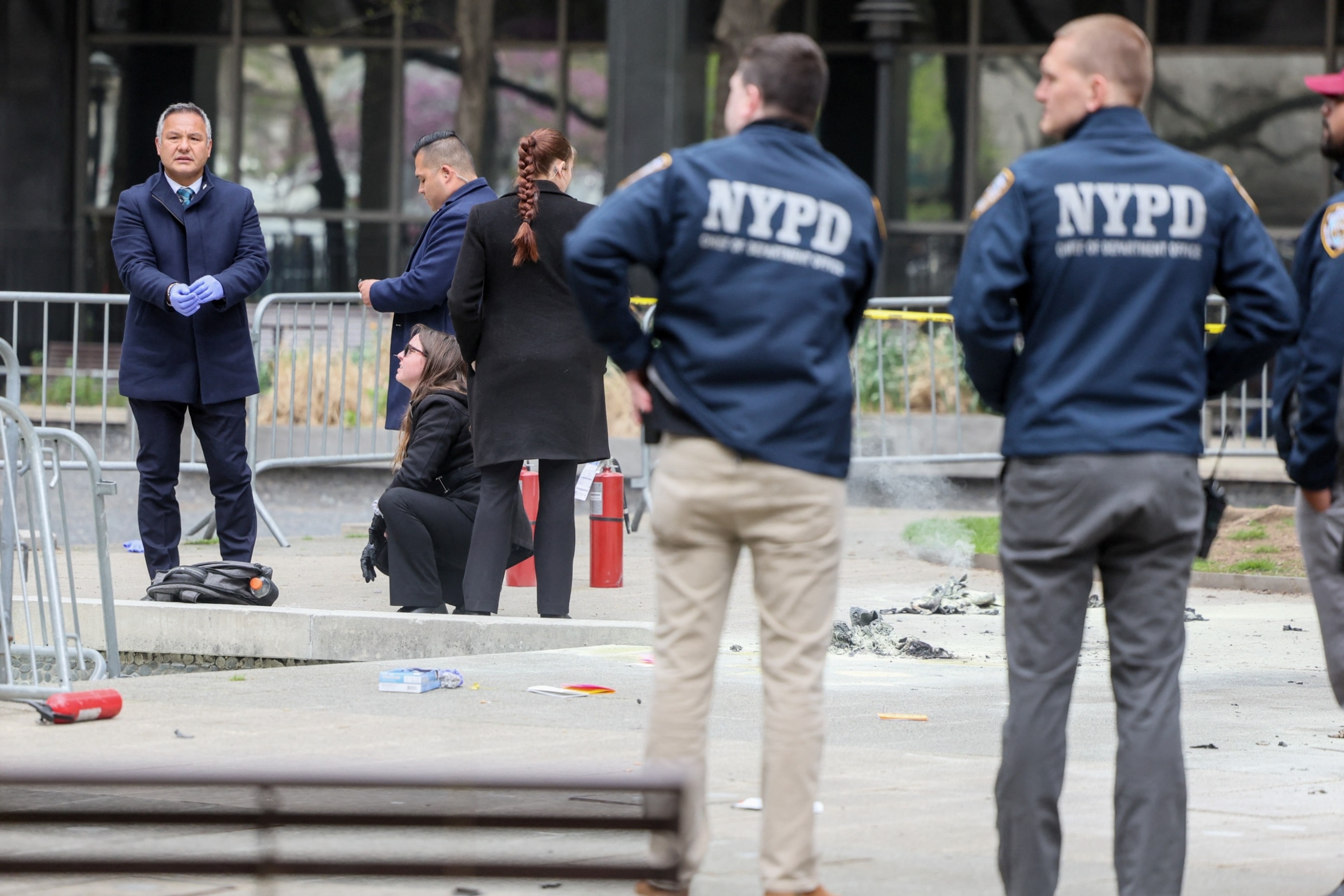 PHOTO: Emergency personnel respond to a report of a person covered in flames, outside the courthouse where former President Donald Trump's criminal hush money trial is underway, in New York, April 19, 2024.