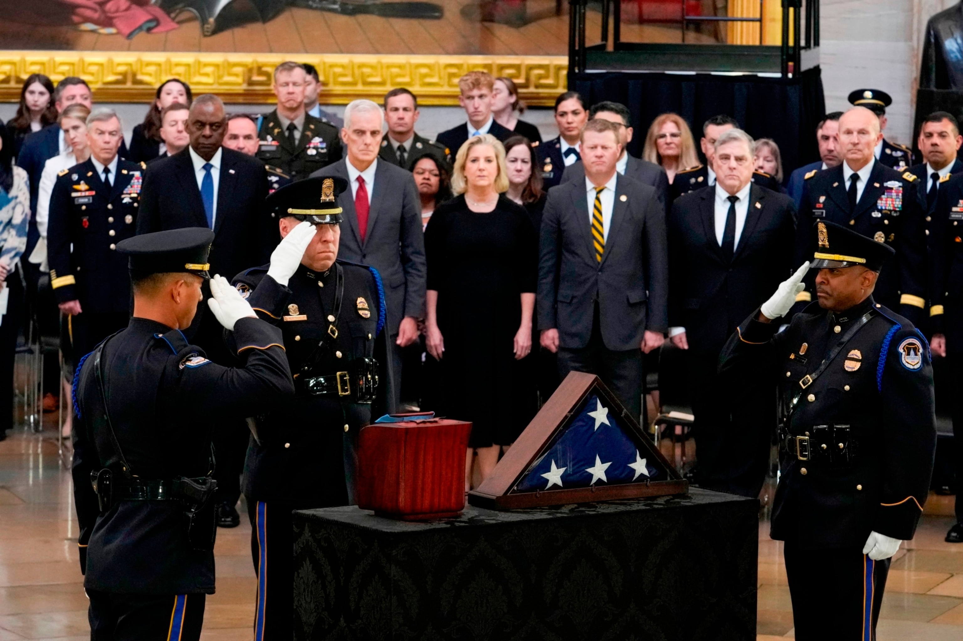 PHOTO: A U.S. Capitol Police honor guard salutes the cremated remains of retired Army Col. Ralph Puckett Jr. during his congressional tribute in the rotunda of the U.S. Capitol on April 29, 2024 in Washington, DC.