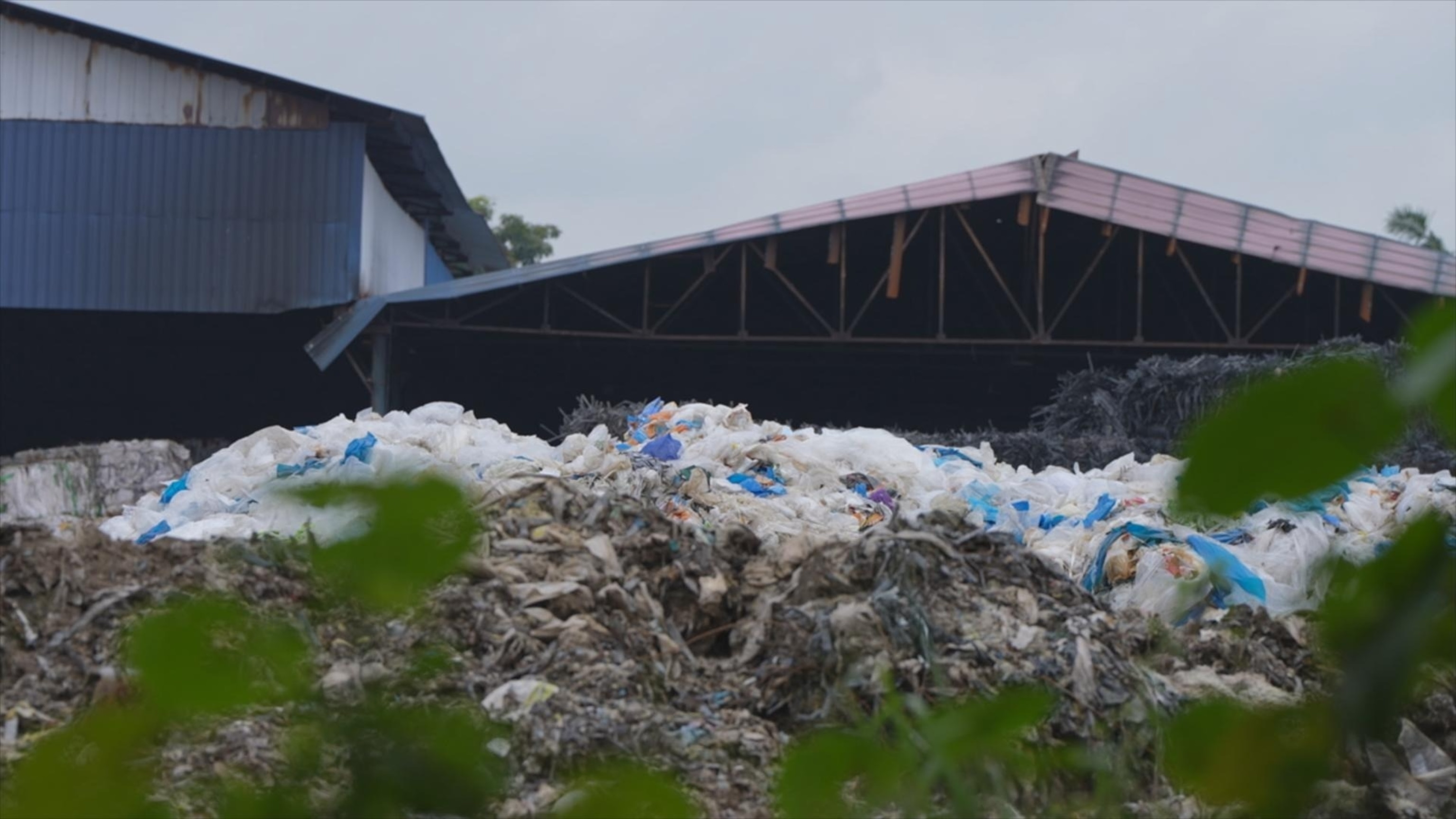 PHOTO: Piles of degrading plastic waste seen inside a plastic manufacturing facility outside Jenjarom, Malaysia.