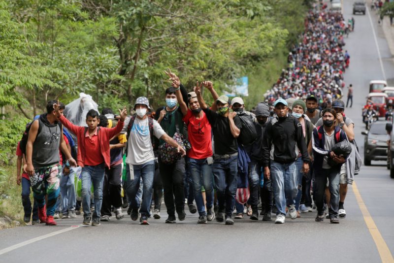 EL FLORIDO, GUATEMALA - JANUARY 16: Migrants enter Guatemala after breaking a police barricade at the border checkpoint on January 16, 2021 in El Florido, Guatemala. The caravan departed from Honduras to walk across Guatemala and Mexico to eventually reach the United States. Central Americans expect to receive asylum and most Hondurans decided to migrate after being hit by recent hurricanes Eta and Iota. Honduras recently asked to U.S. to extend their Temporary Protected Status. (Photo by Josue Decavele/Getty Images)