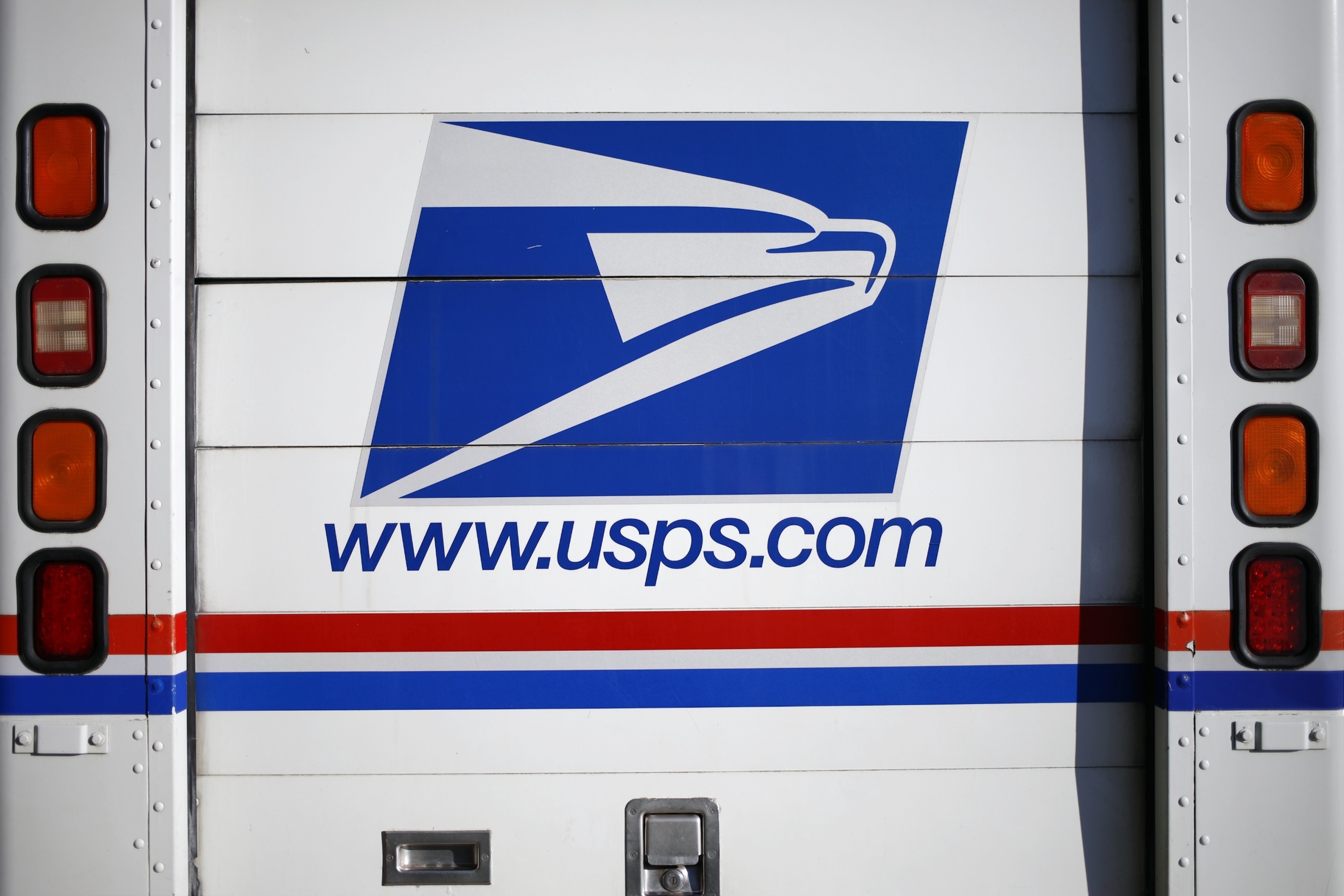 PHOTO: A USPS mail delivery vehicle is seen outside a post office, July 3, 2022, in Louisville, Ky.