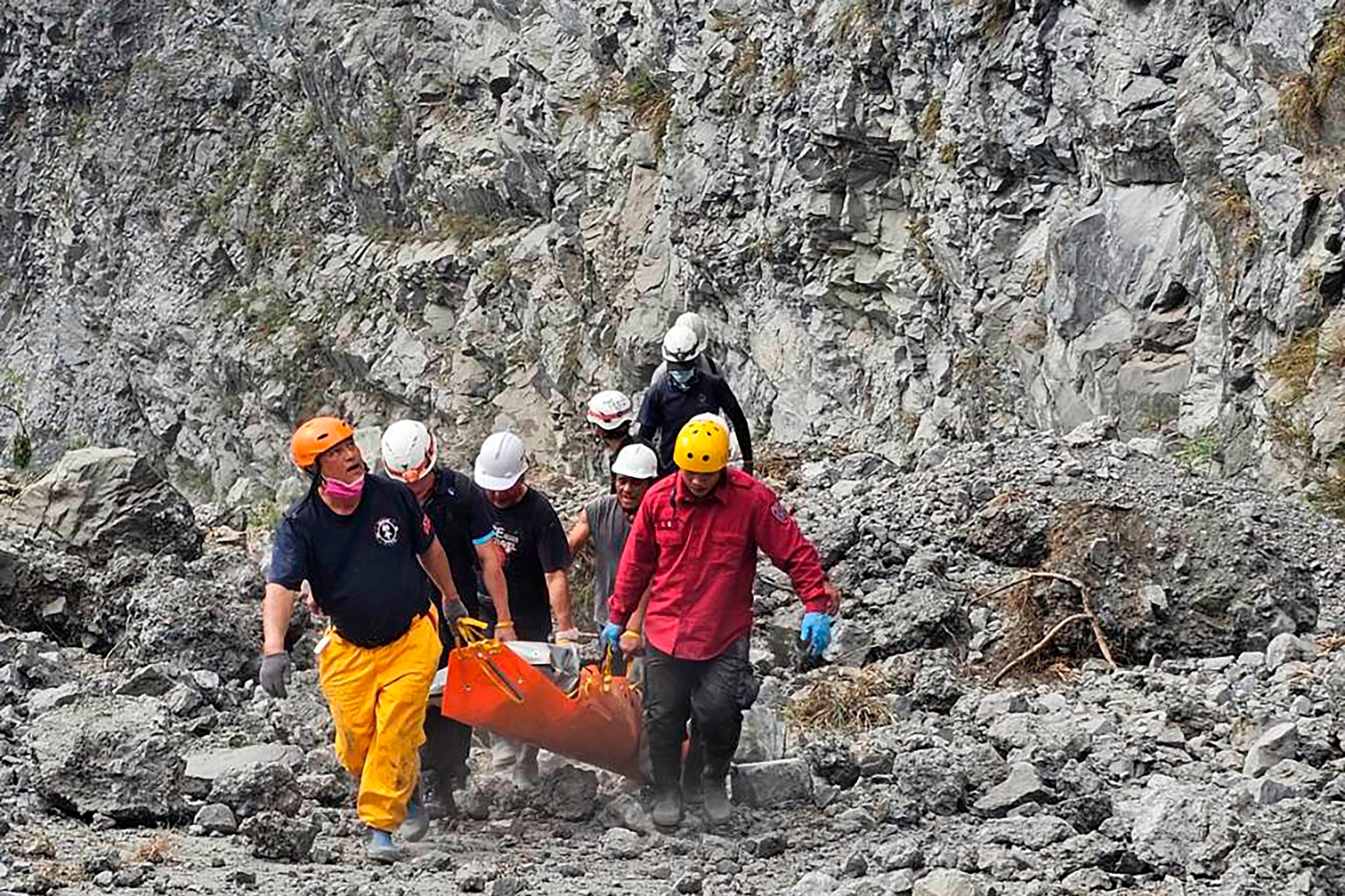 PHOTO: In this photo released by the Hualien Fire Department, firefighters and quarry workers evacuate a body from the Ho Ren Quarry a day after a powerful earthquake struck in Hualien County, eastern Taiwan, Thursday, April 4, 2024. 