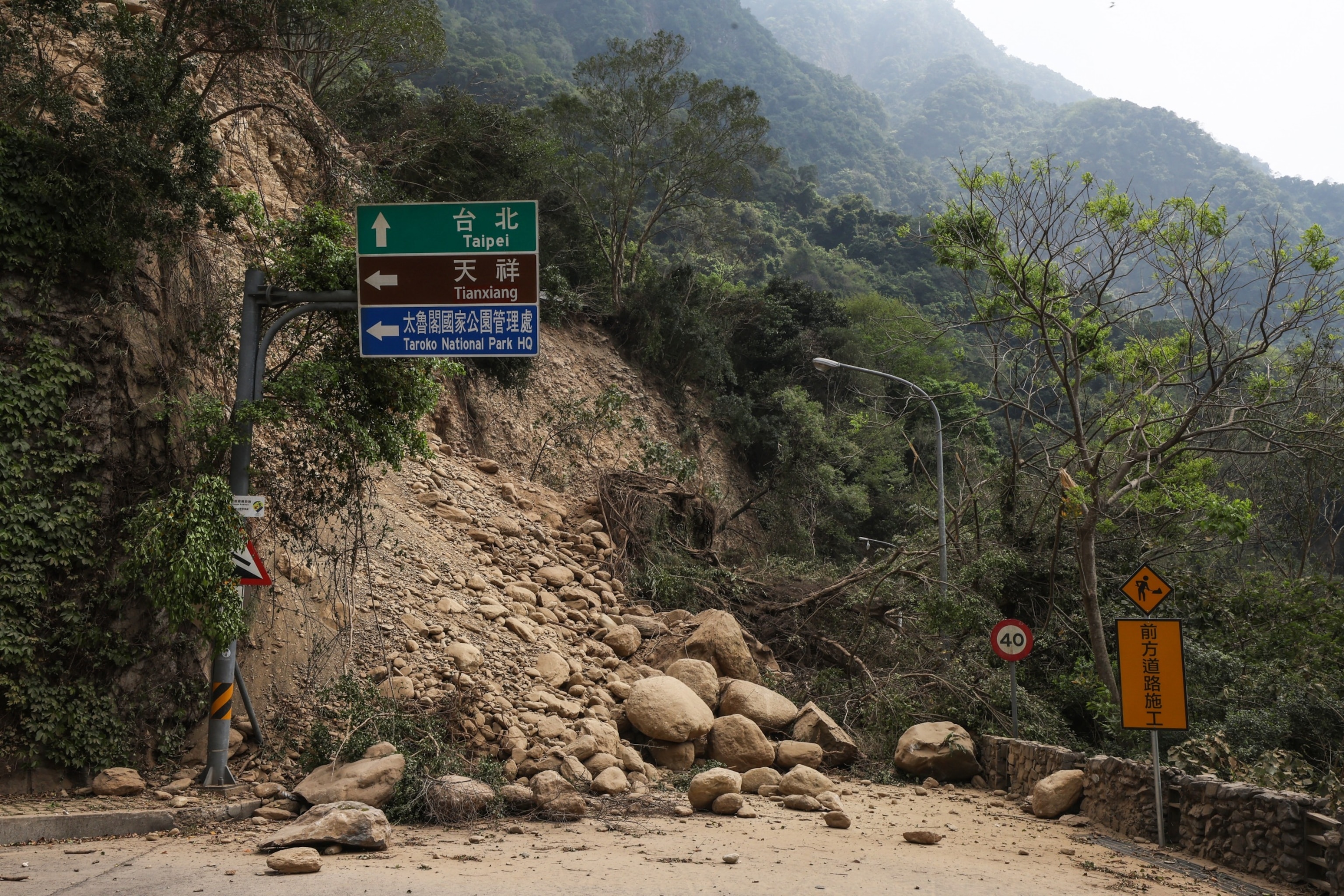 PHOTO: This photo taken by Taiwan's Central News Agency on April 4, 2024 shows a road blocked by fallen rocks in Hualien, after a major earthquake hit Taiwan's east.